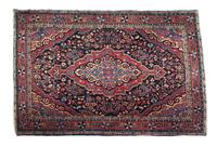 A Persian Wool Rug 57 1/2 x 39 1/2 inches. — 20TH CENTURY