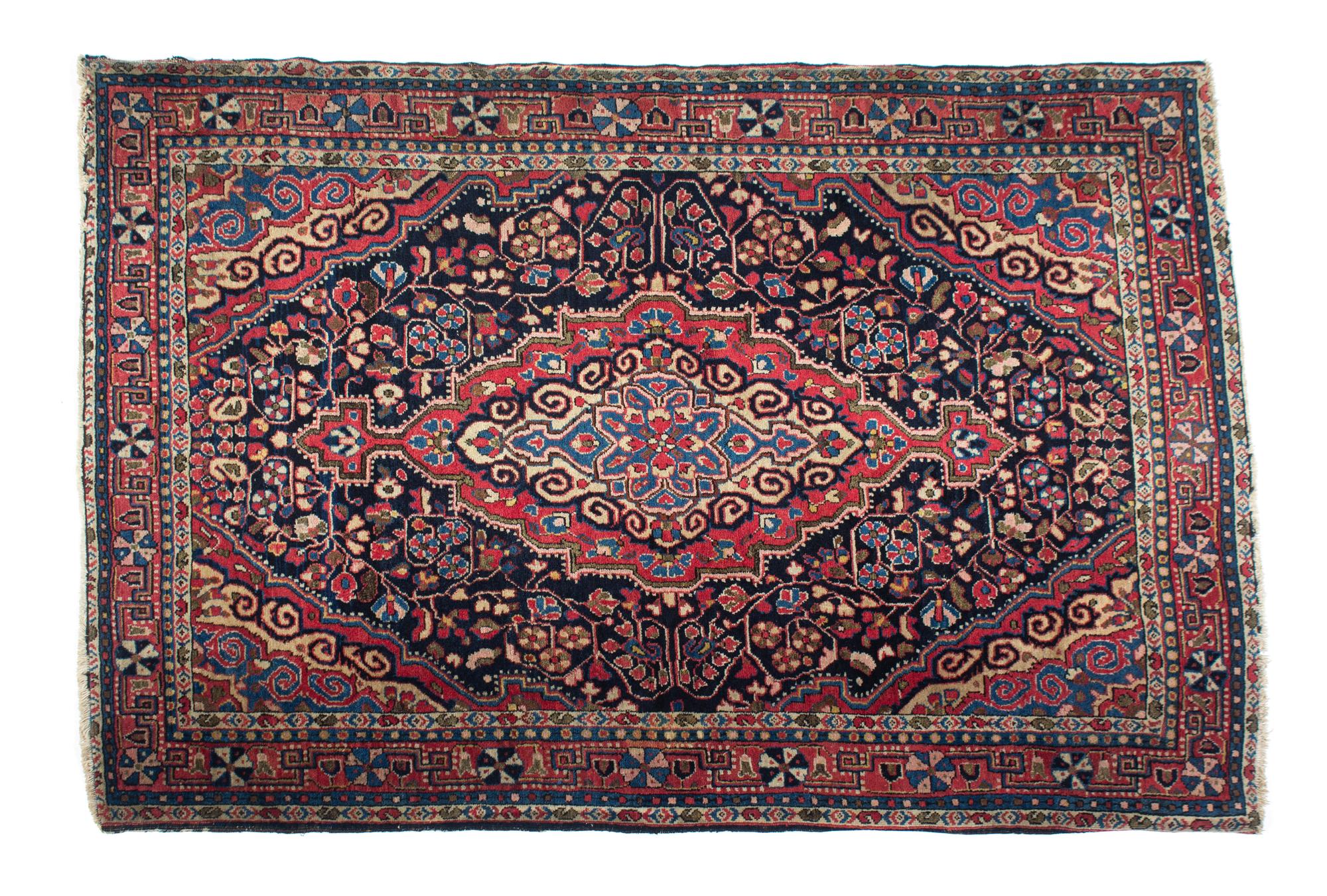 A Persian Wool Rug 57 1/2 x 39 1/2 inches. — 20TH CENTURY