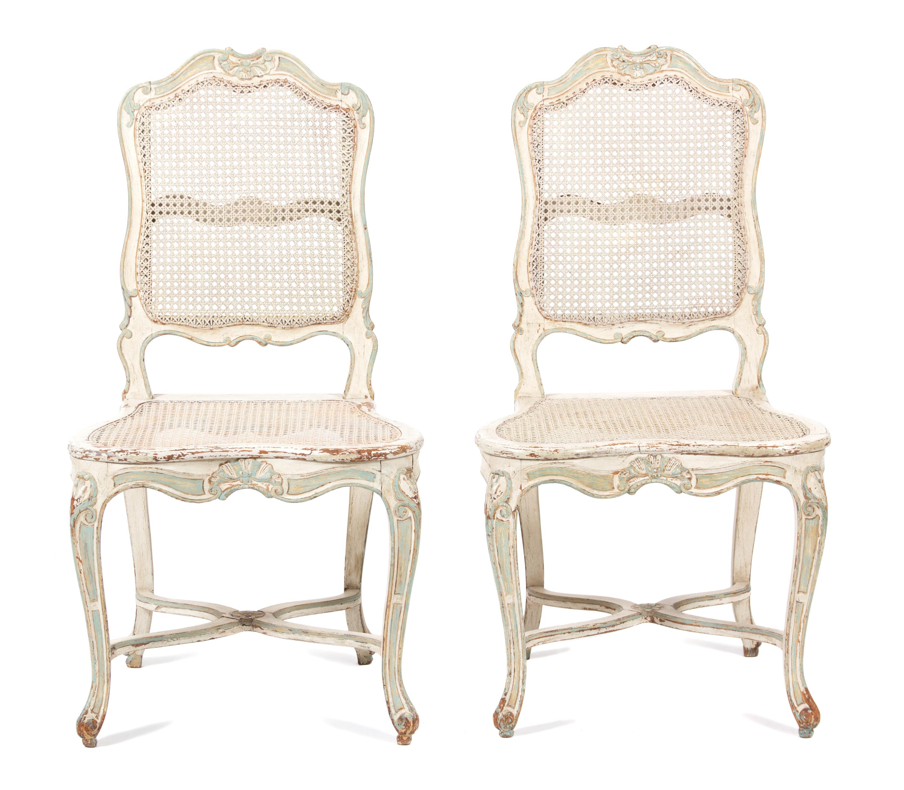 A Pair of Louis XV Style Carved and Painted Caned Back and Seat Side Chairs Height 38 1/2 inches. — 19TH CENTURY