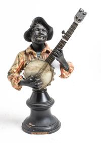 A Painted Cast Metal Bust of a Banjo Player Height 10 3/4 inches. — 19TH CENTURY