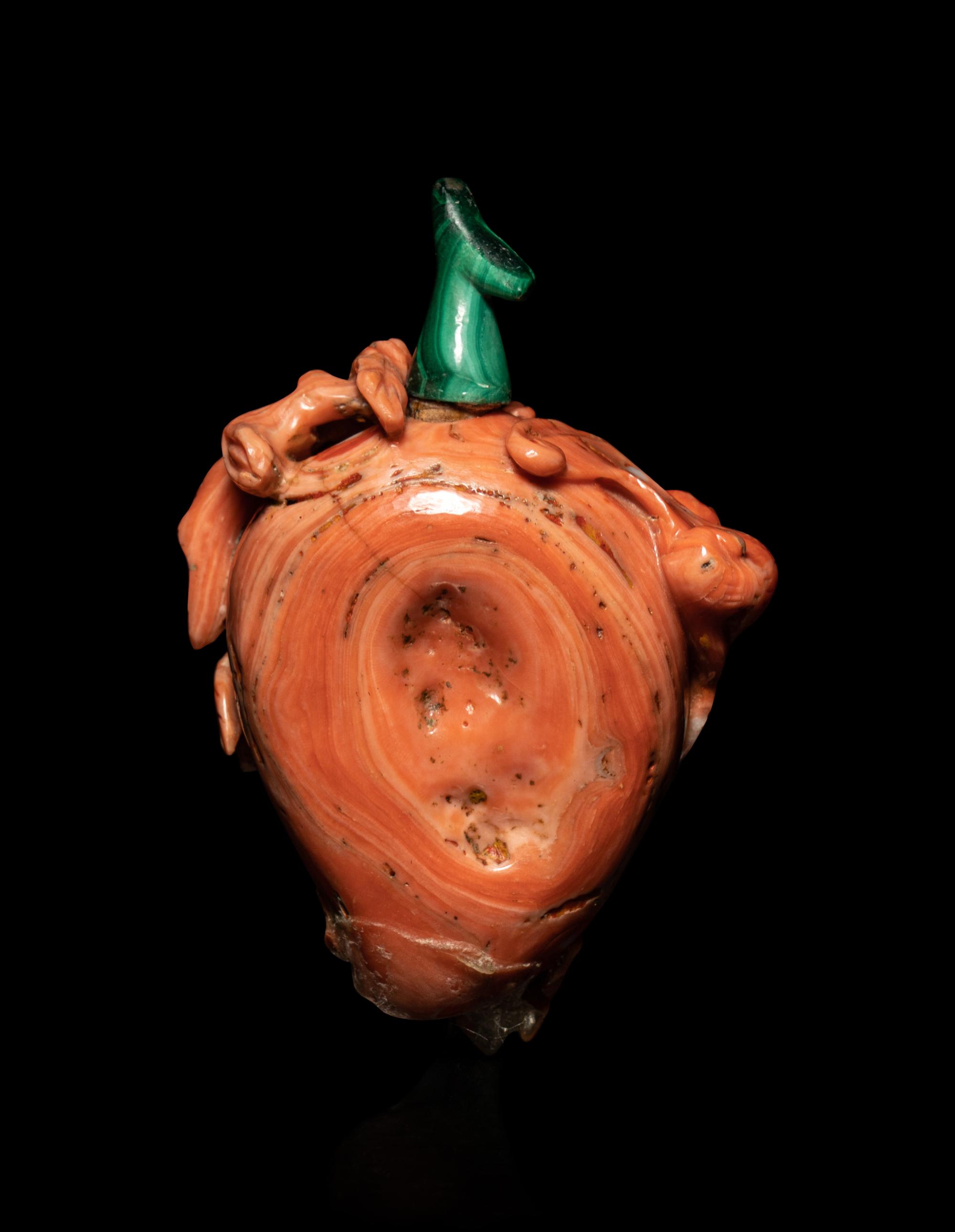A Carved Red Coral Snuff Bottle