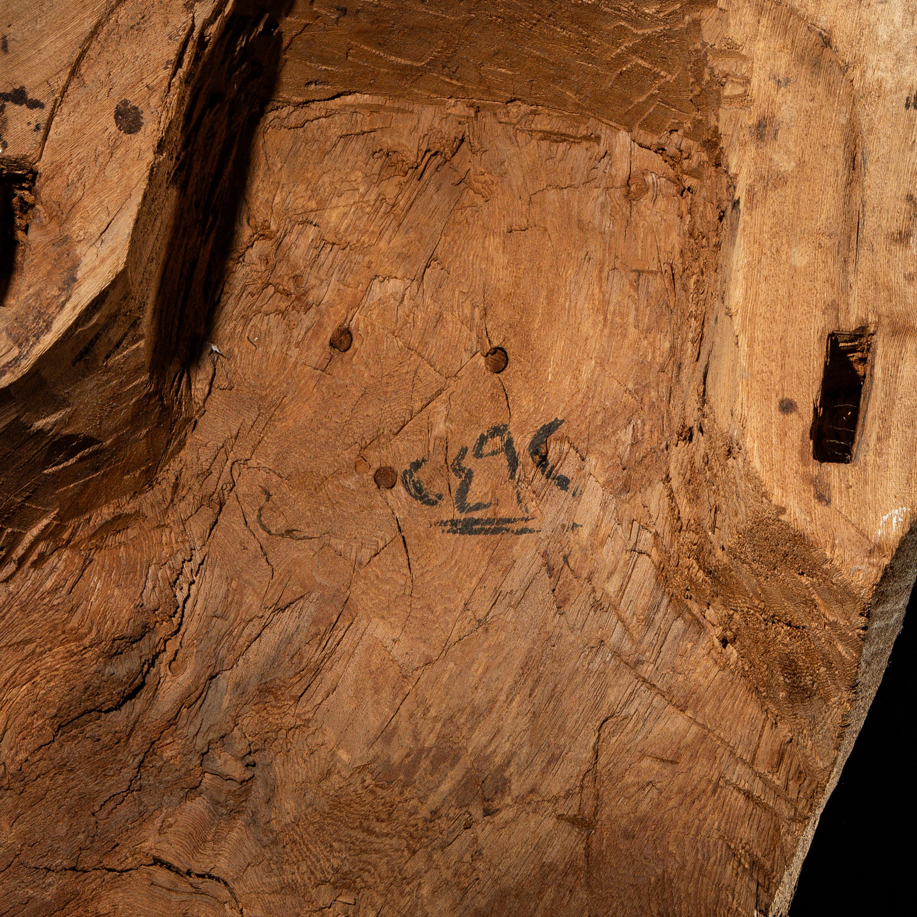 An Egyptian Painted Wood Sarcophagus Head