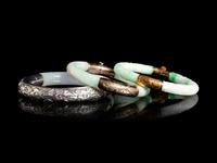Three Chinese Silver and 14K Yellow Gold Jadeite Bangles