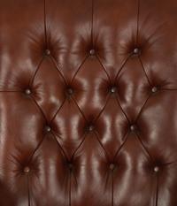 A Regency Style Leather Upholstered Mahogany Open Armchair — 20th Century