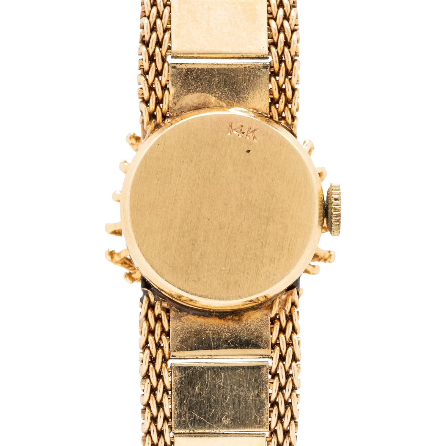 LUVA, 14K YELLOW GOLD AND DIAMOND SURPRISE WATCH