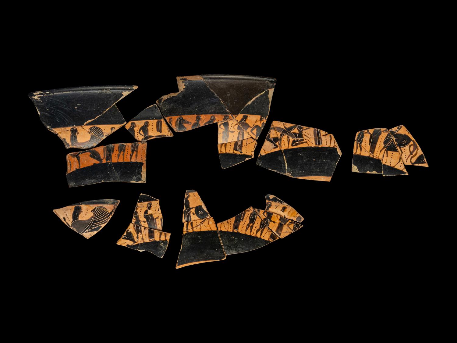 18 Attic Black-Figured Band Cup Fragments with Warriors and Sphinxes