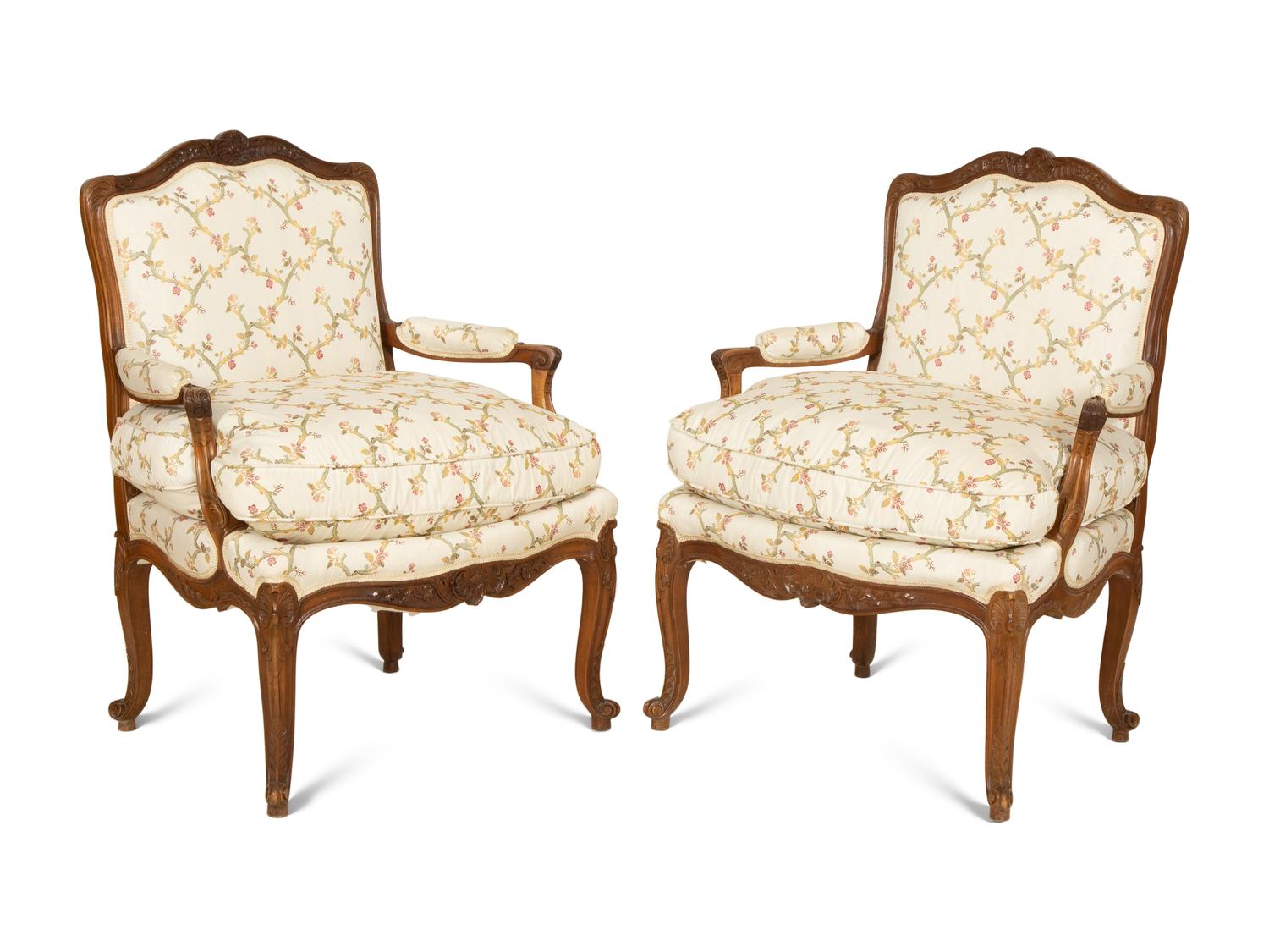 A Pair of Louis XV Style Carved Mahogany Fauteuils