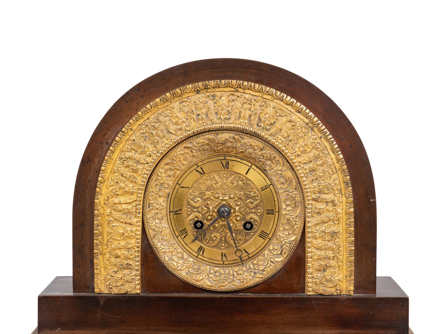 A Charles X Gilt and Patinated Bronze and Mirrored Glass Mantel Clock