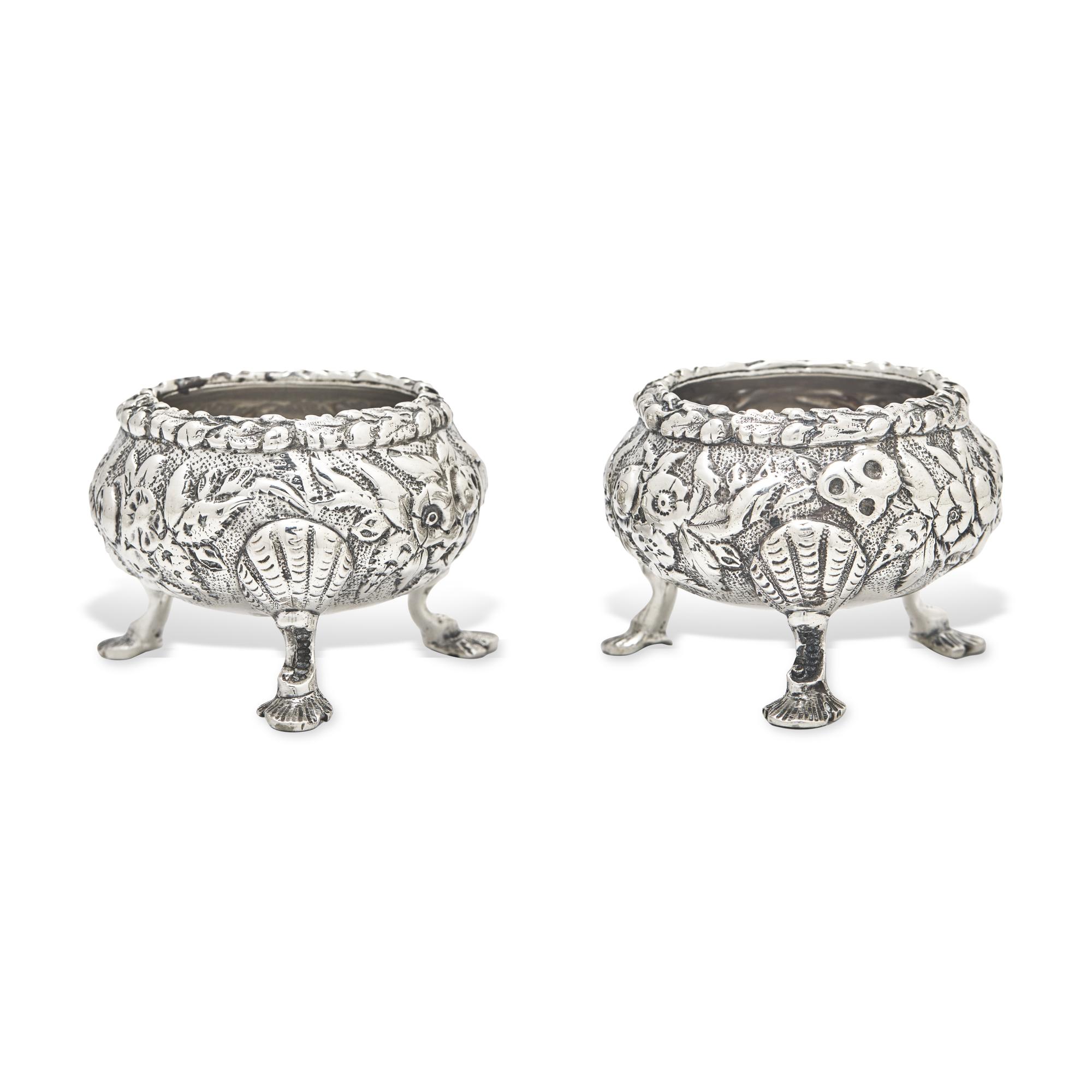 A Pair of Sterling Silver Floral Repousse Salt Cellars