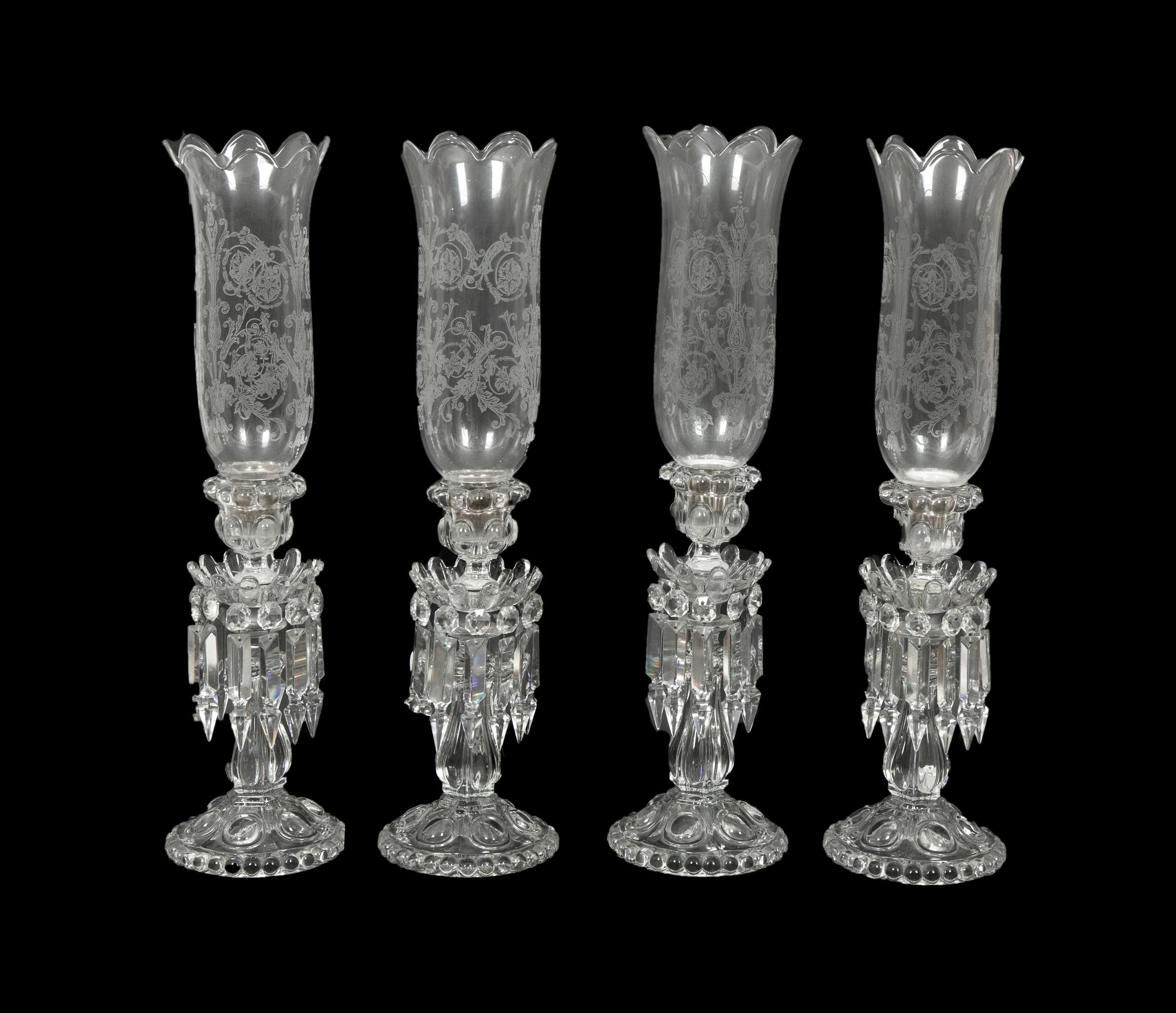 A Set of Four Baccarat Glass Hurricane Lamps