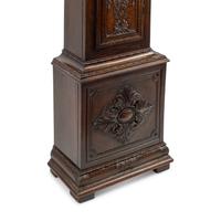 An English Carved Oak Tall Case Clock