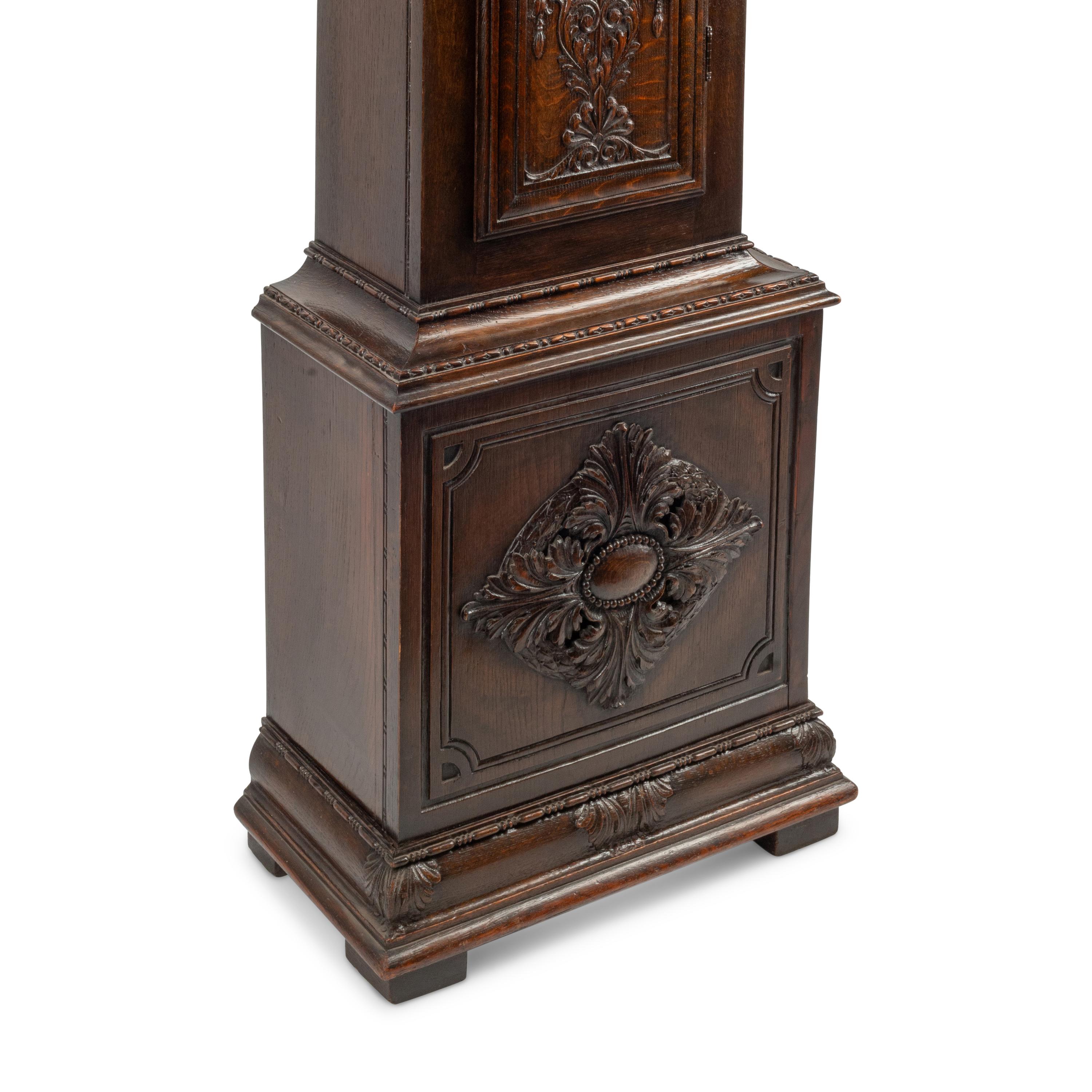 An English Carved Oak Tall Case Clock