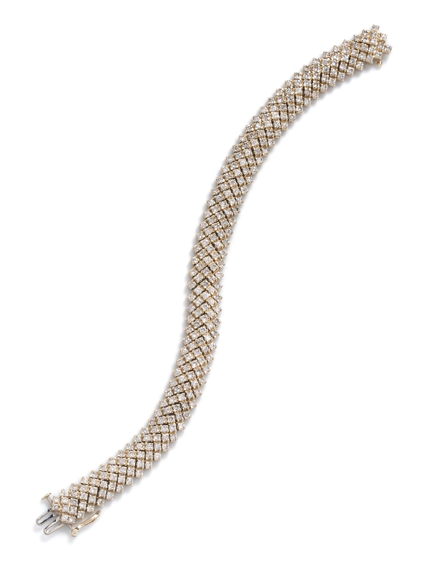 A 14 Karat Yellow Gold and Diamond Bracelet,