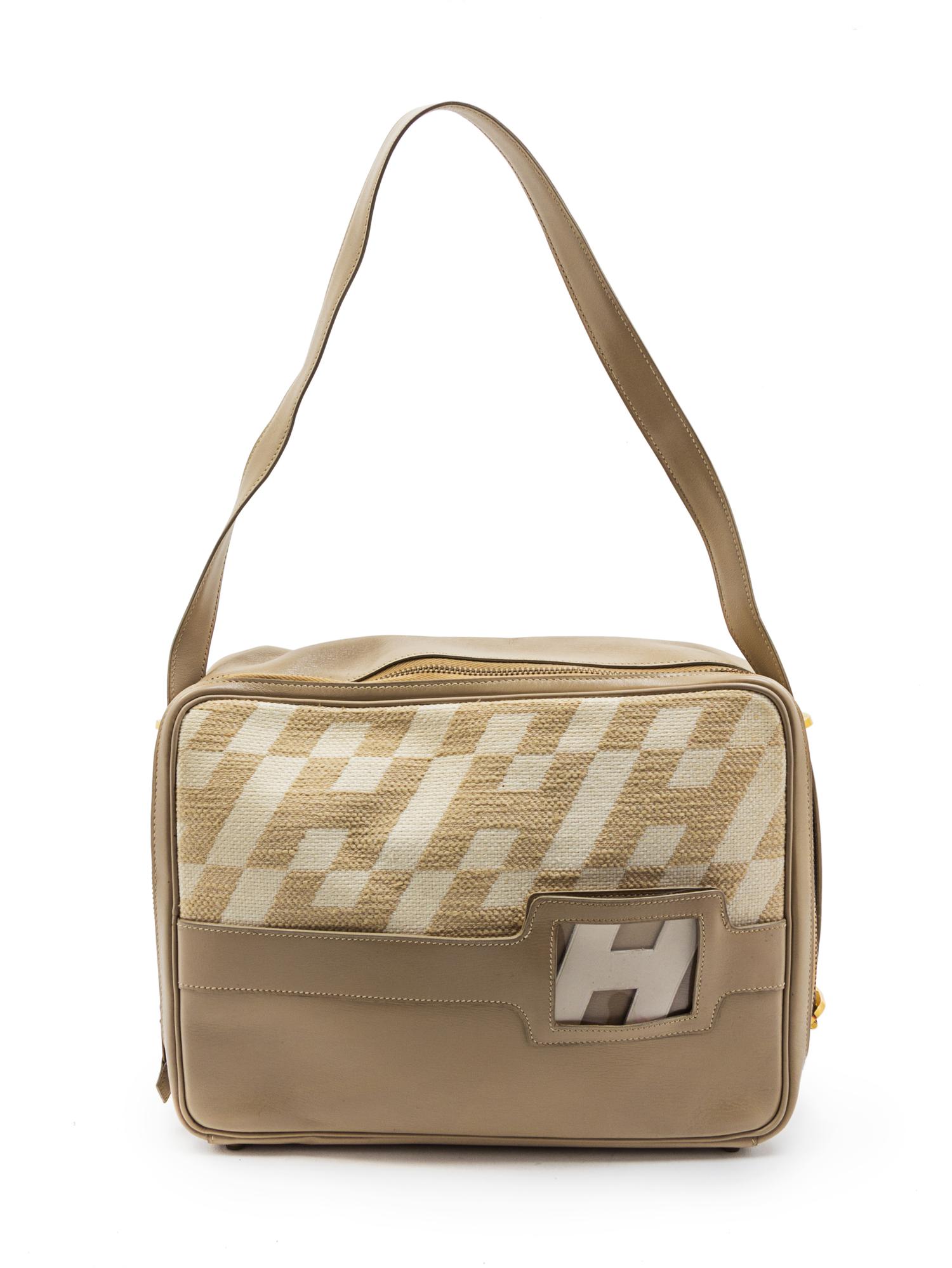 A Rare Hermes Ulysses Ivory Canvas and Leather Bag, 12 x 9 x 3 1/2 inches.