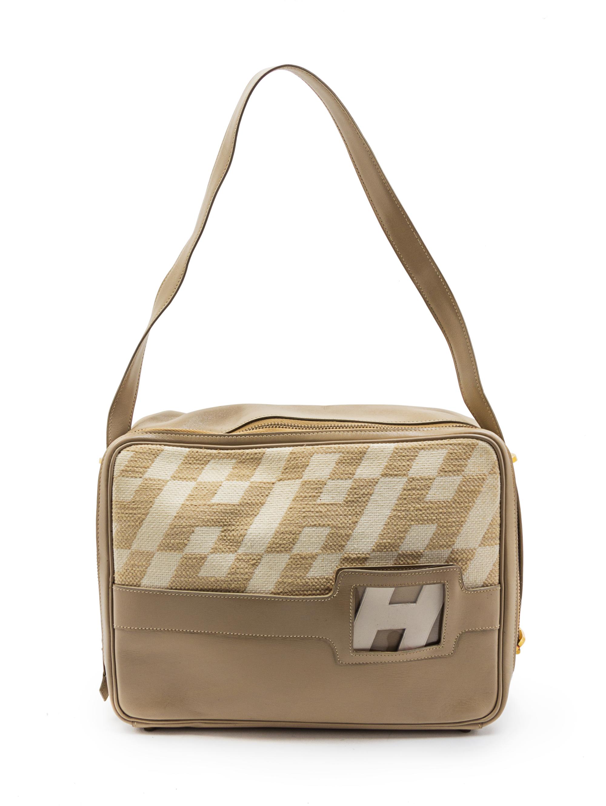 A Rare Hermes Ulysses Ivory Canvas and Leather Bag, 12 x 9 x 3 1/2 inches.