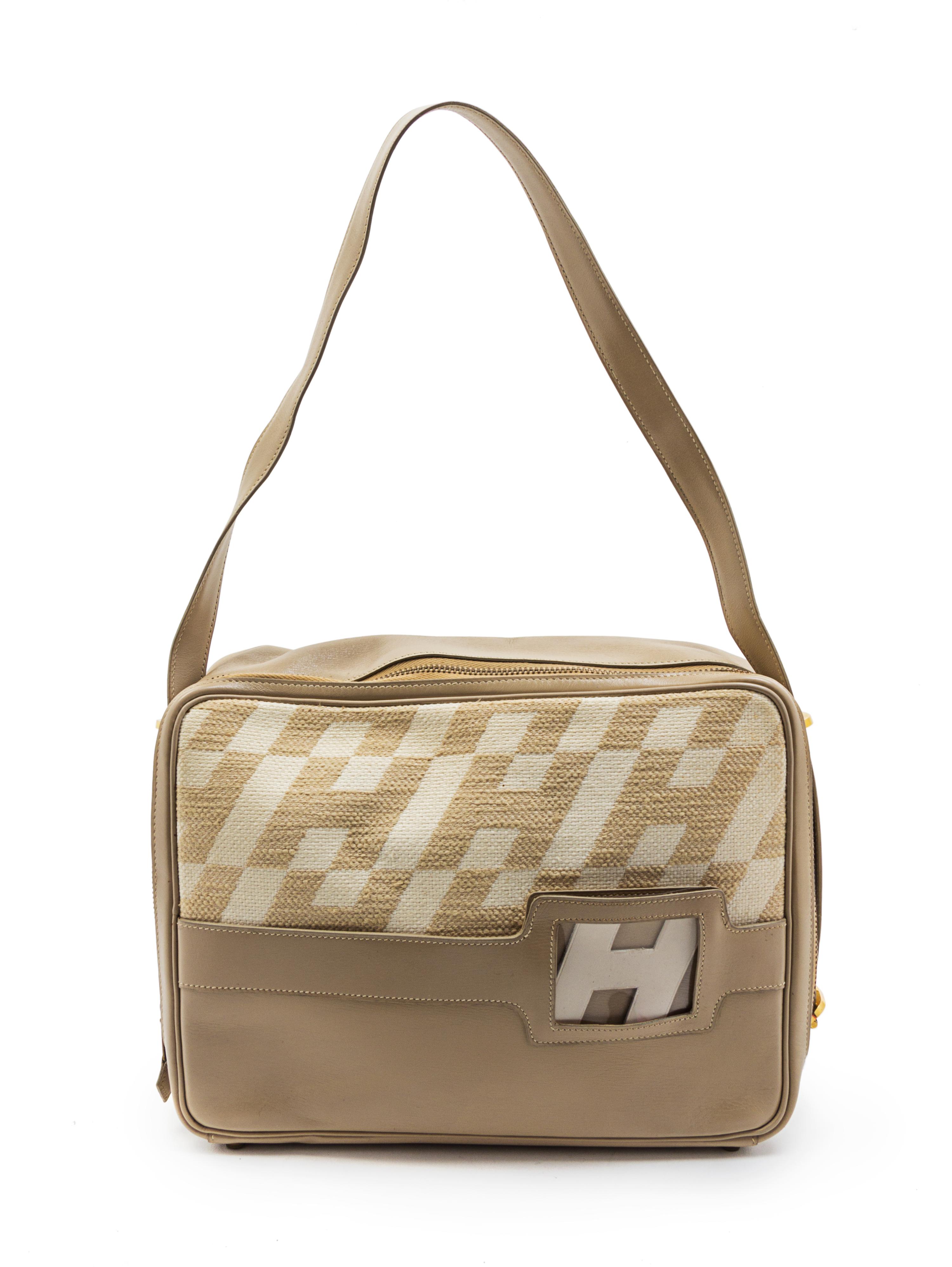 A Rare Hermes Ulysses Ivory Canvas and Leather Bag, 12 x 9 x 3 1/2 inches.