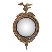 A Regency Style Giltwood Bull's Eye Looking Glass