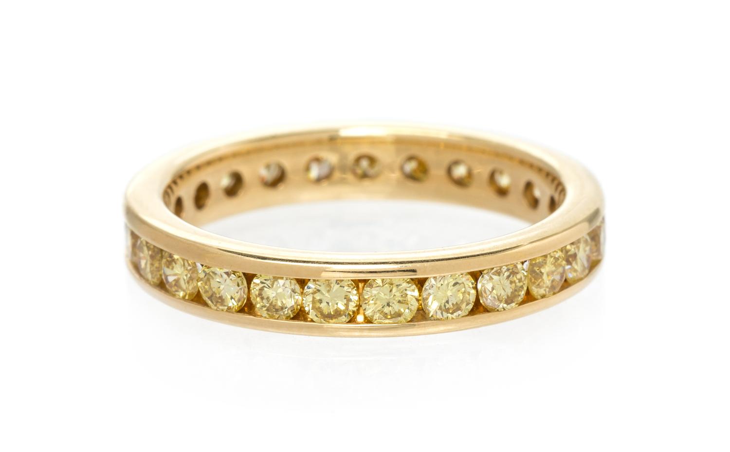 A Yellow Gold and Colored Diamond Eternity Band, 2.55 dwts.
