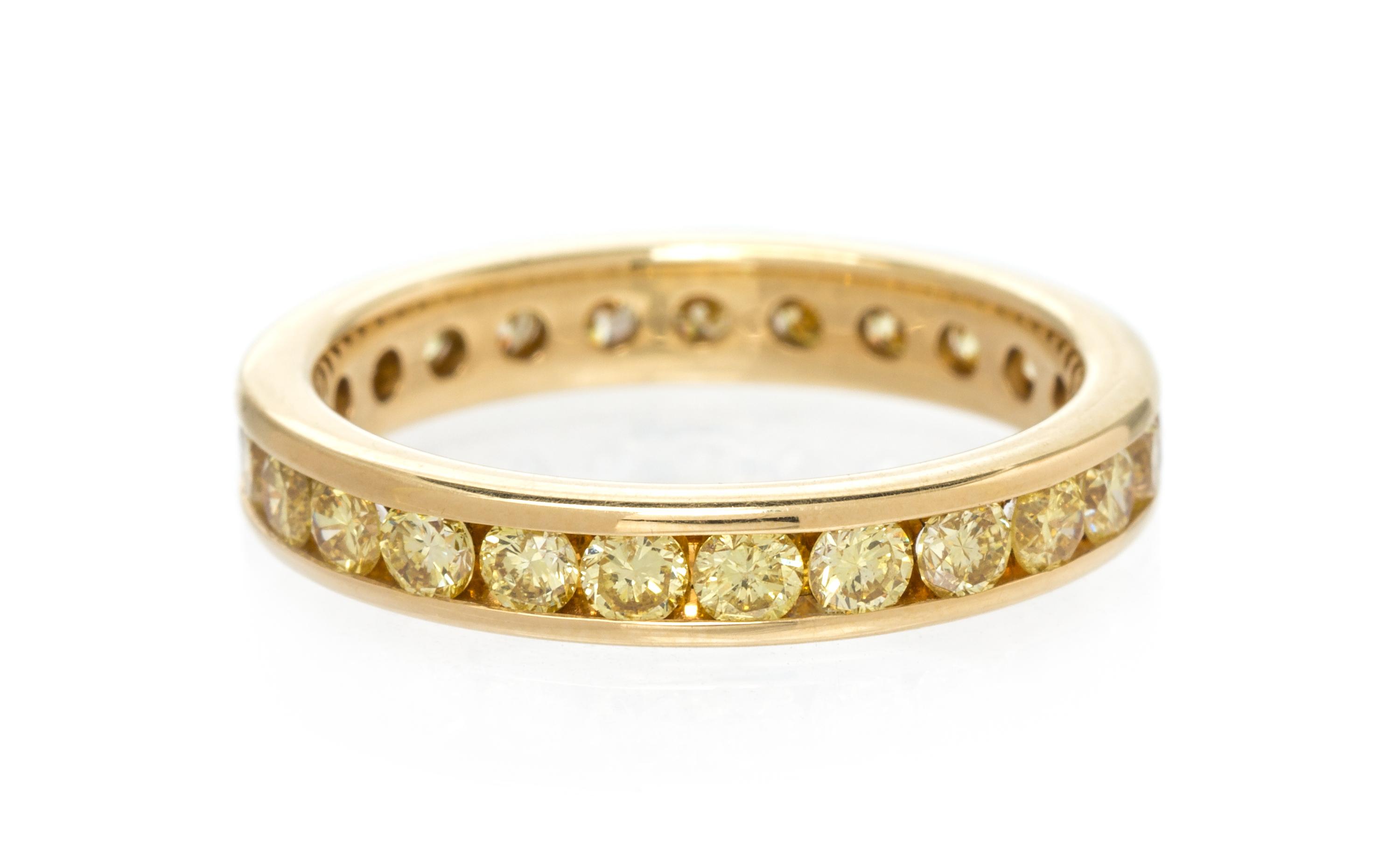 A Yellow Gold and Colored Diamond Eternity Band, 2.55 dwts.