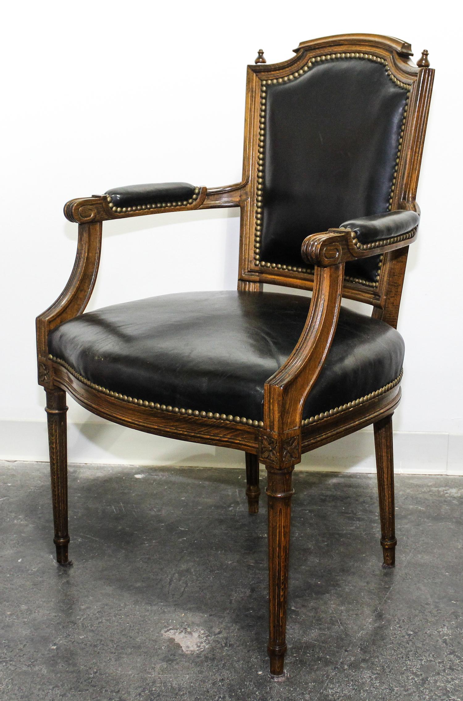 A Leather Upholstered Open Armchair Height 38 inches. — 20TH CENTURY