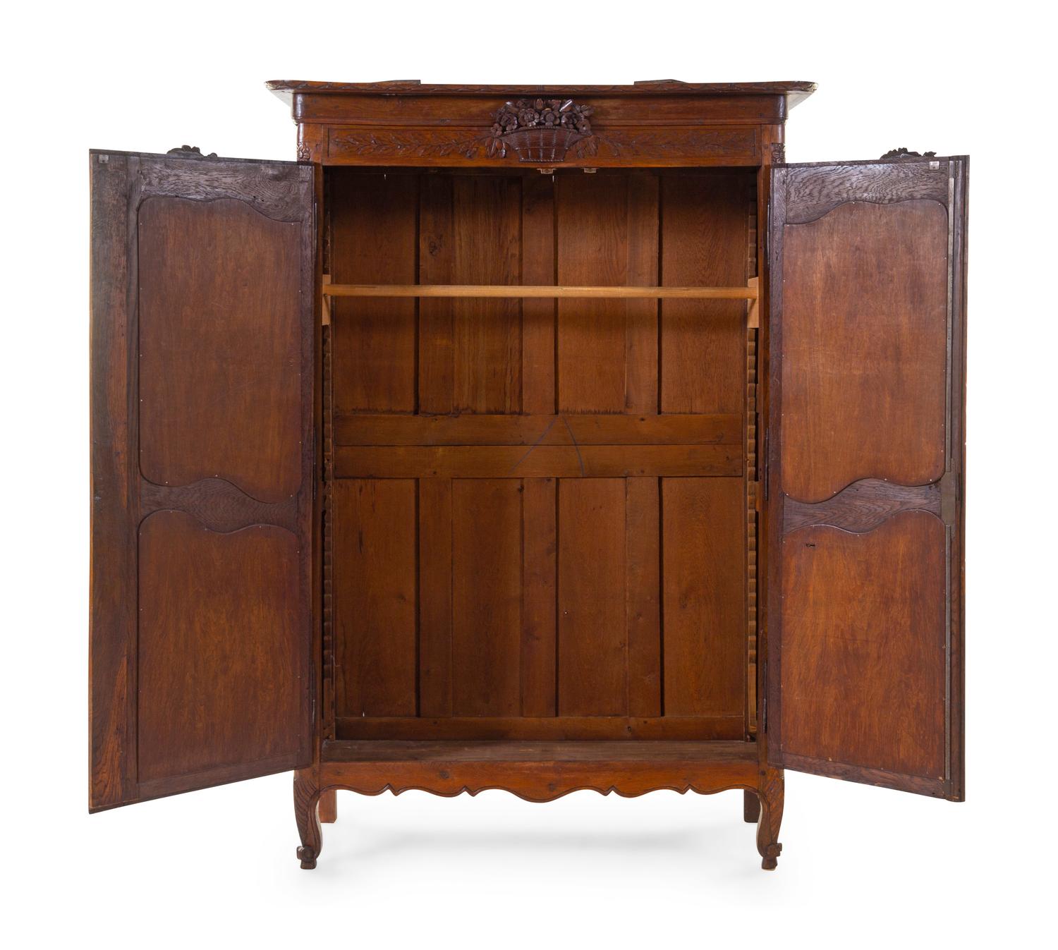 A French Provincial Carved Armoire
