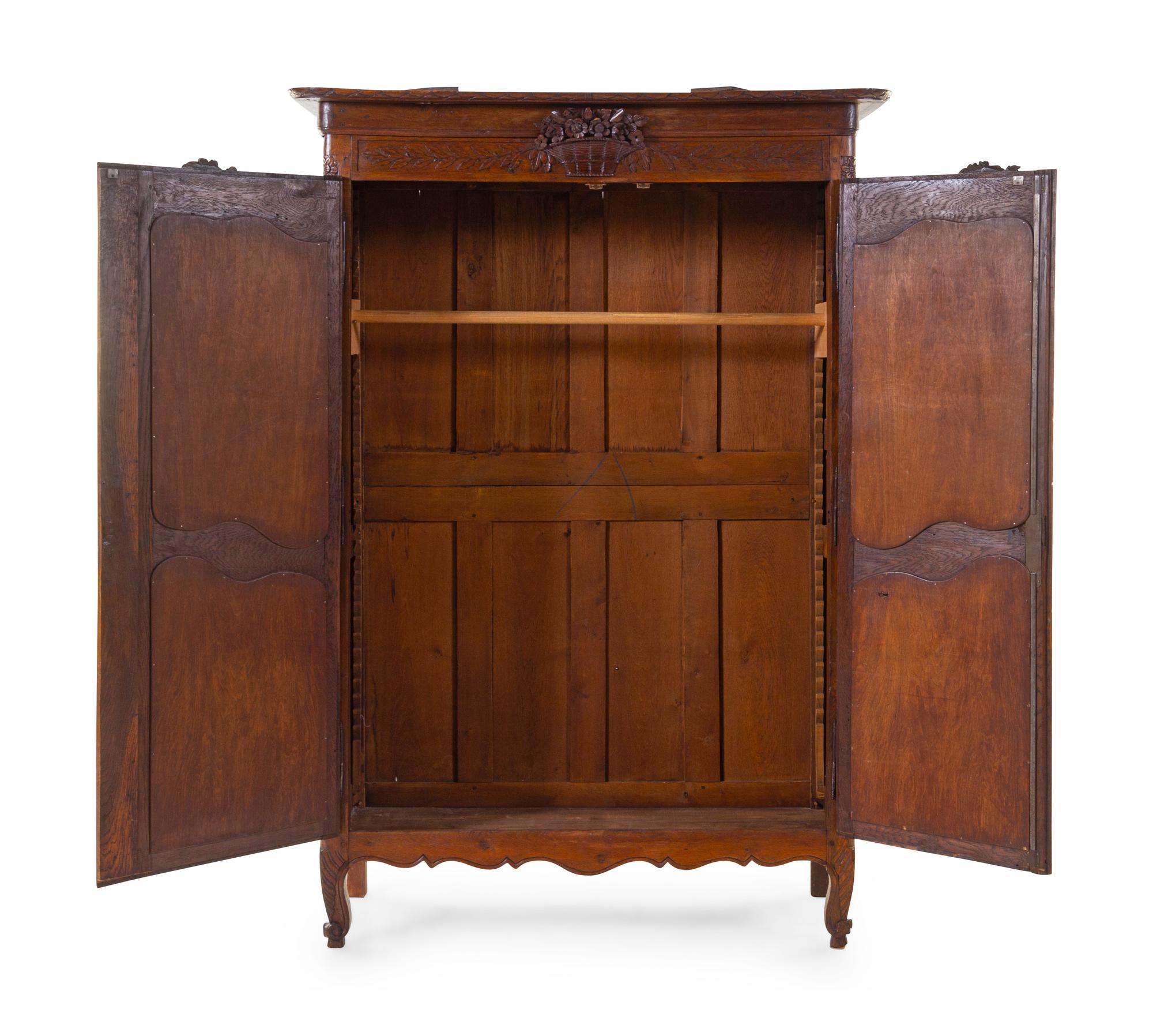 A French Provincial Carved Armoire