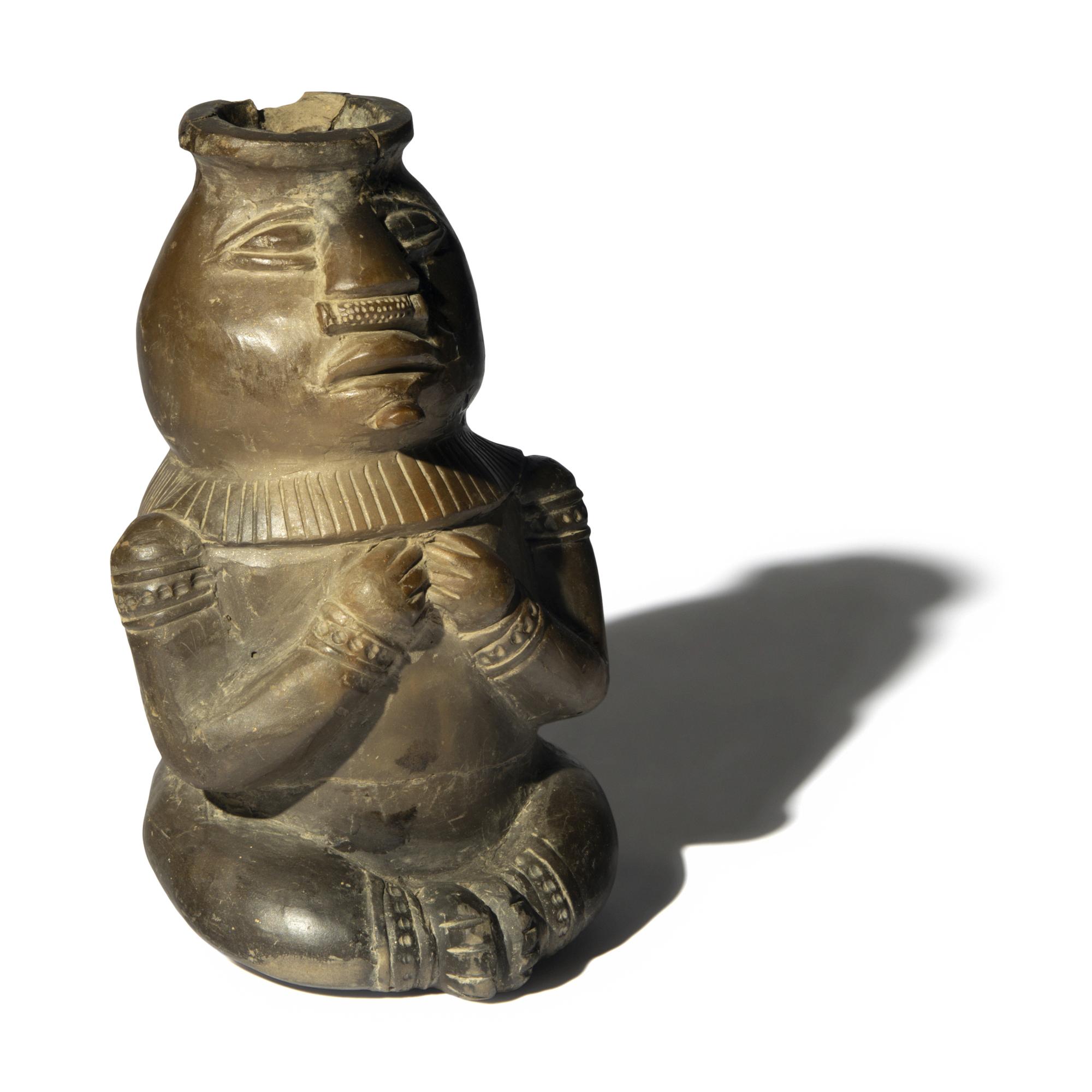 A Peruvian Blackware Effigy Vessel