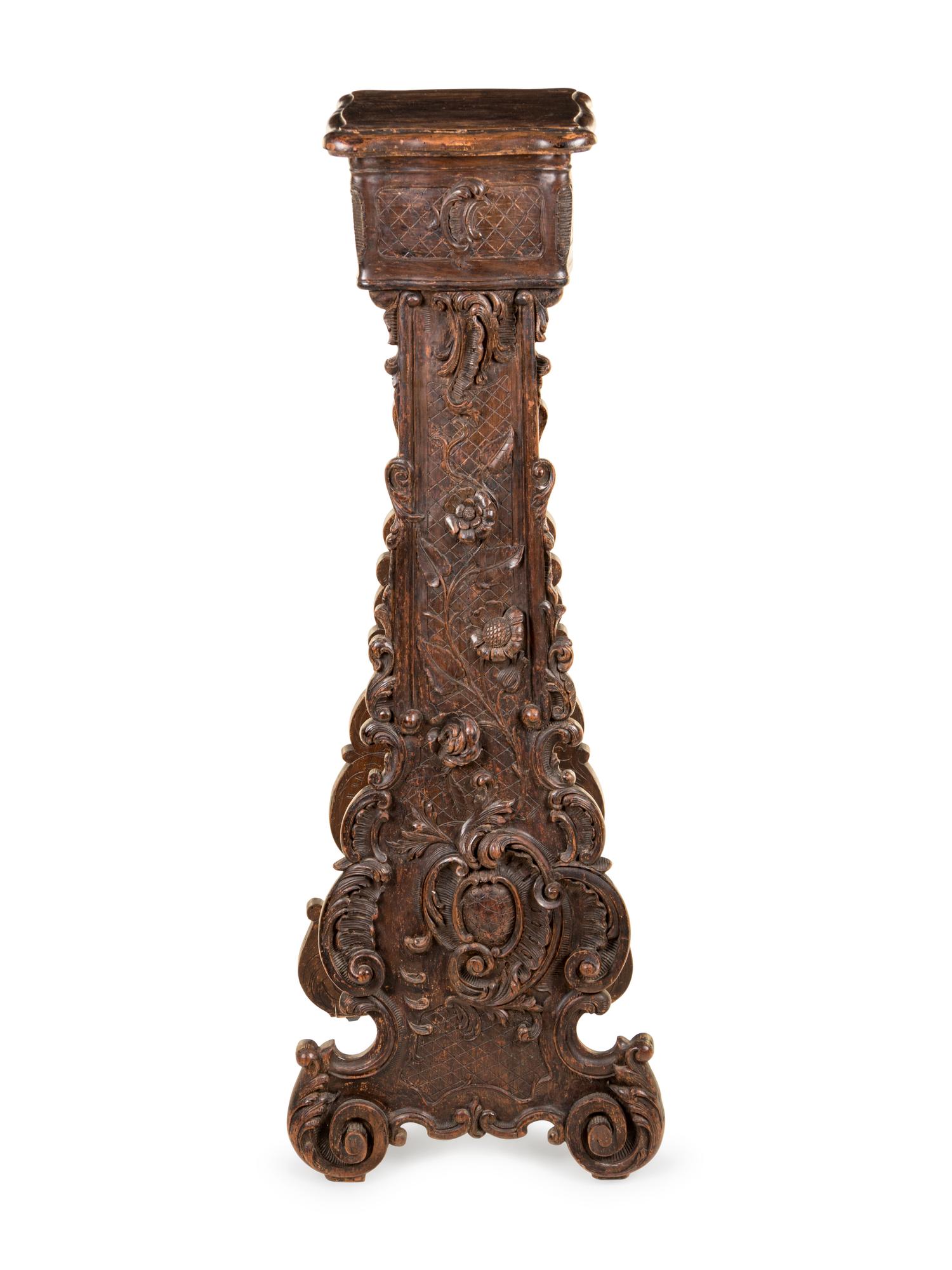 An Italian Baroque Style Carved Walnut Pedestal
