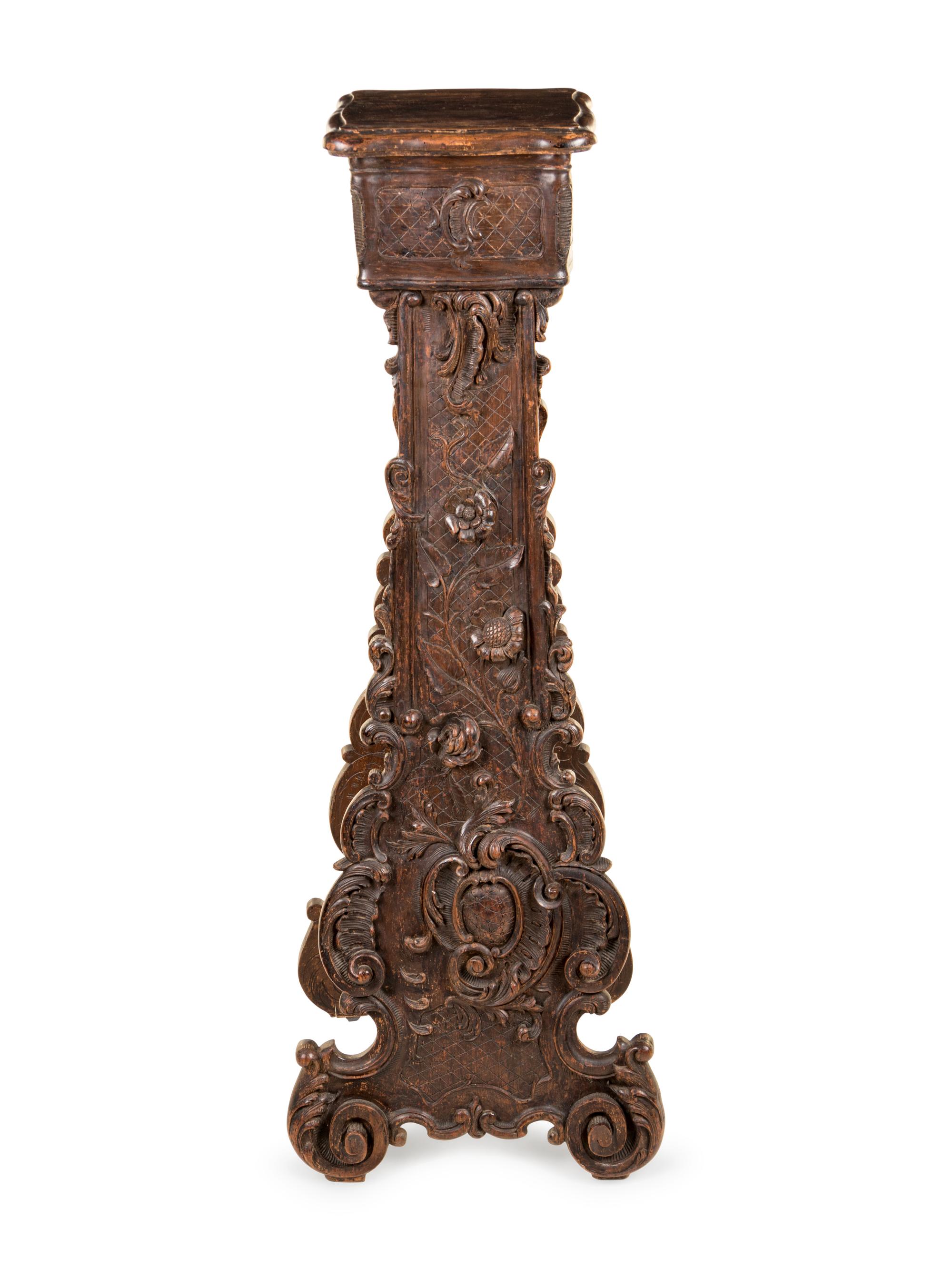 An Italian Baroque Style Carved Walnut Pedestal