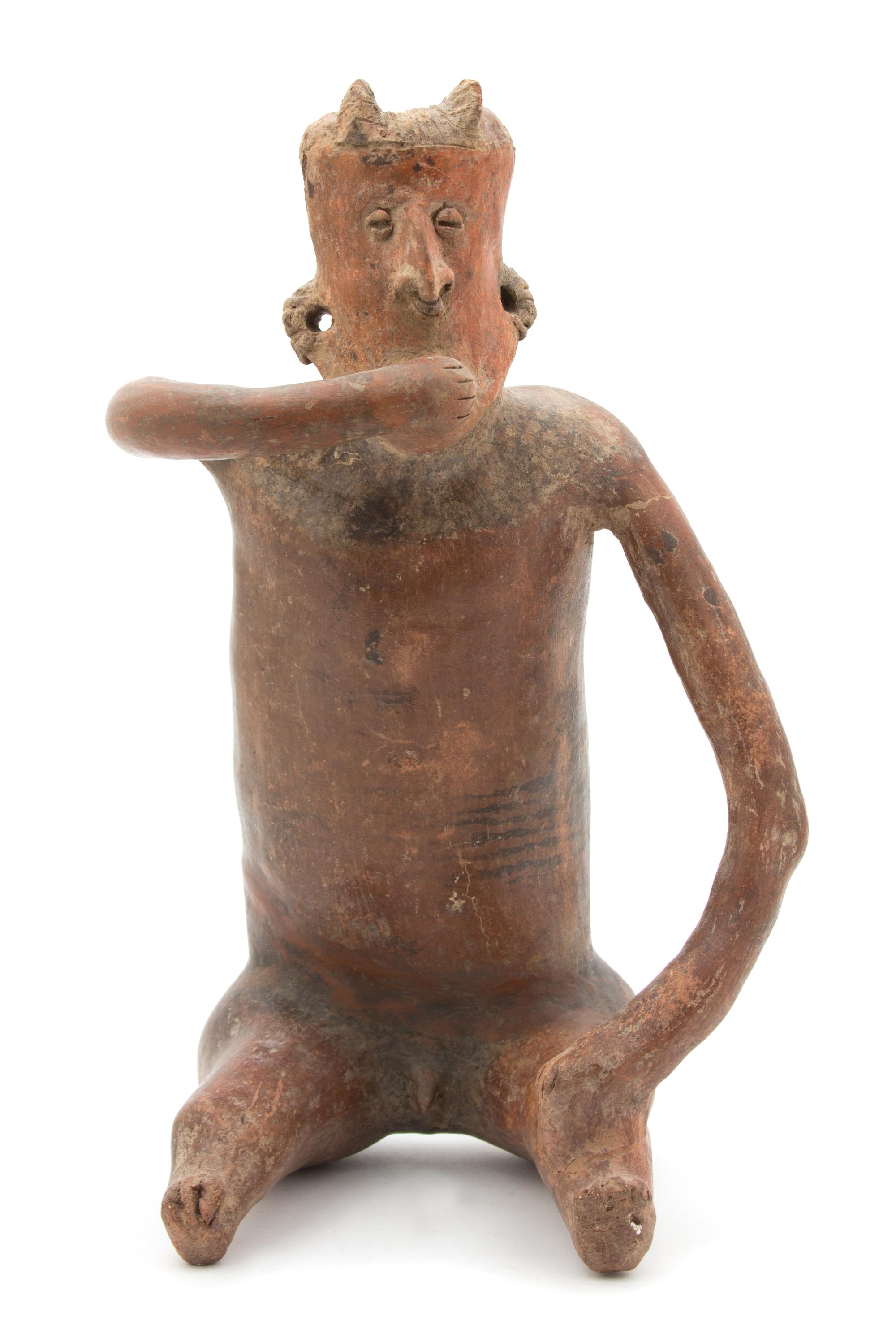 A Nayarit Slip Painted Ceramic Seated Male Figure Height 15 1/4 inches. — CIRCA 100-200 AD