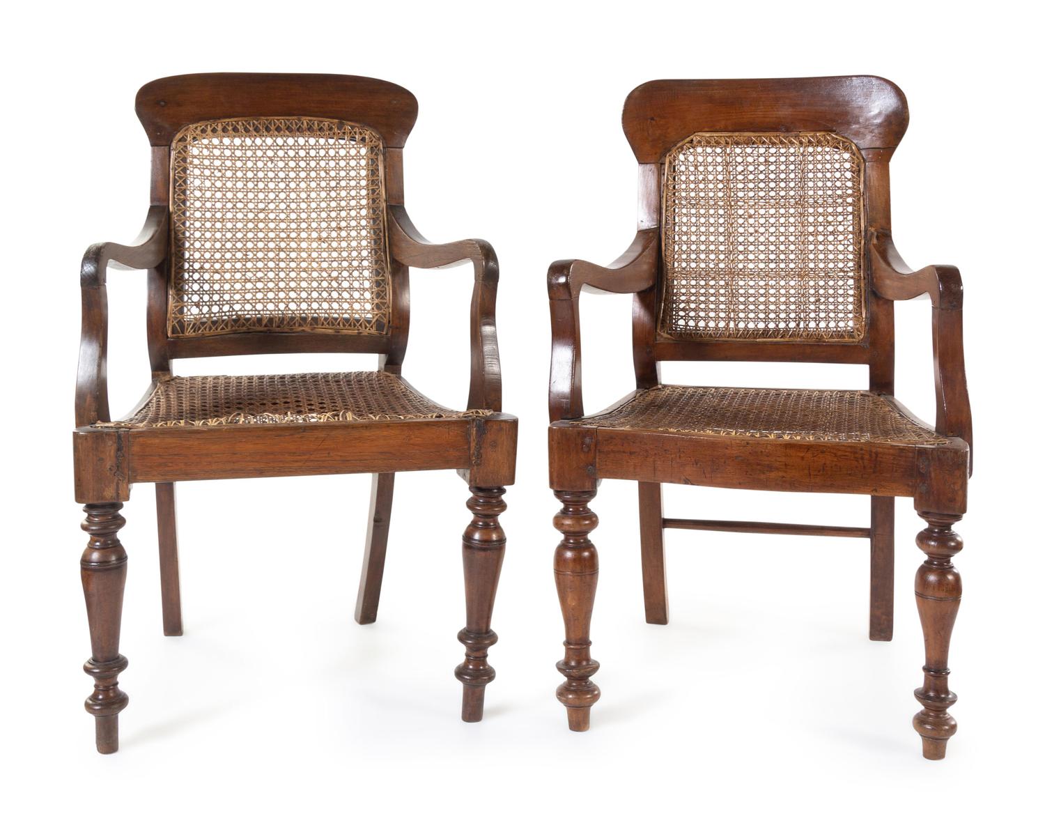 A Near Pair of Anglo-Colonial Teak Armchairs