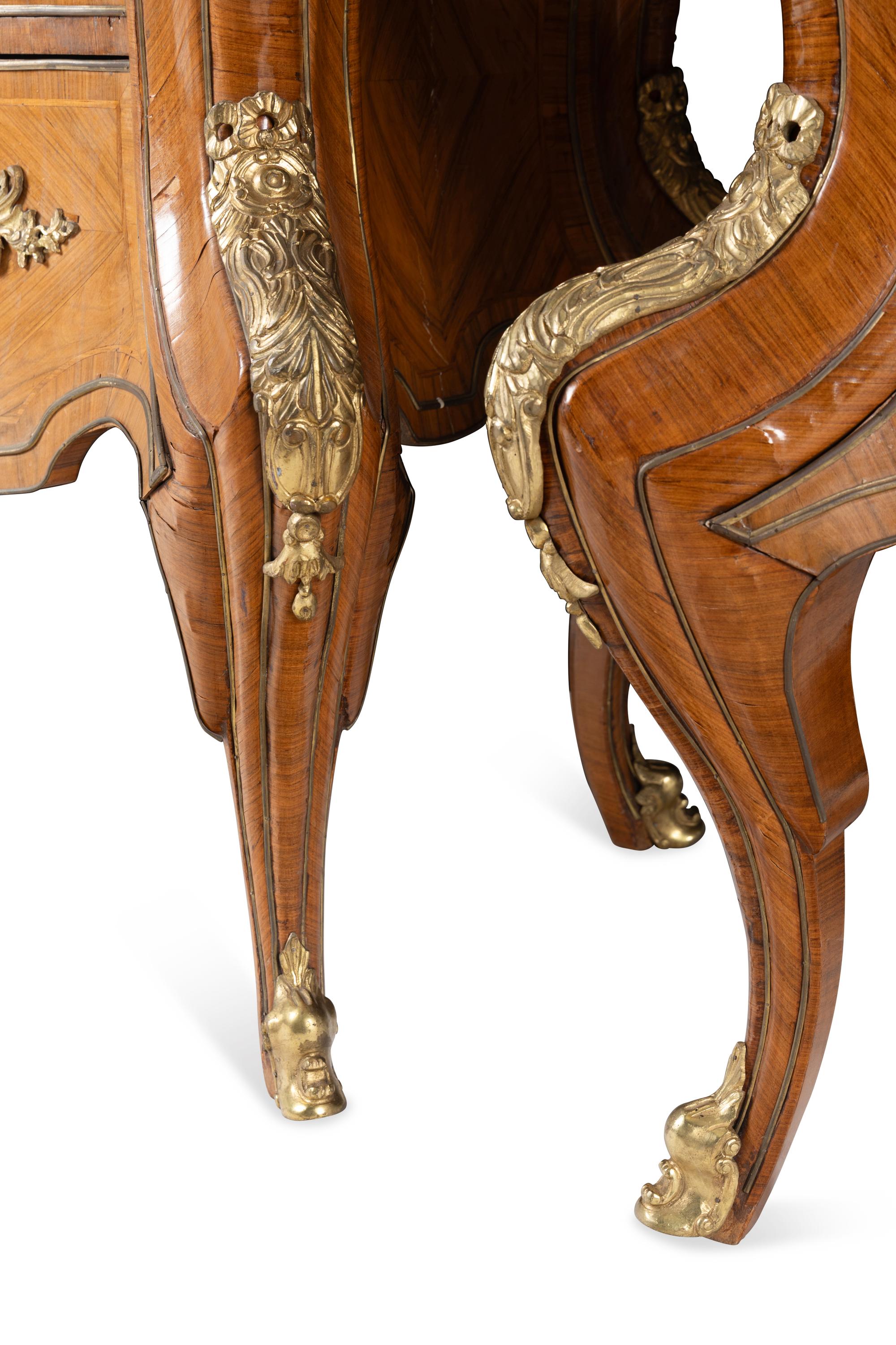 A Pair of Régence Style Gilt Bronze Mounted Tulipwood Marble-Top Commodes