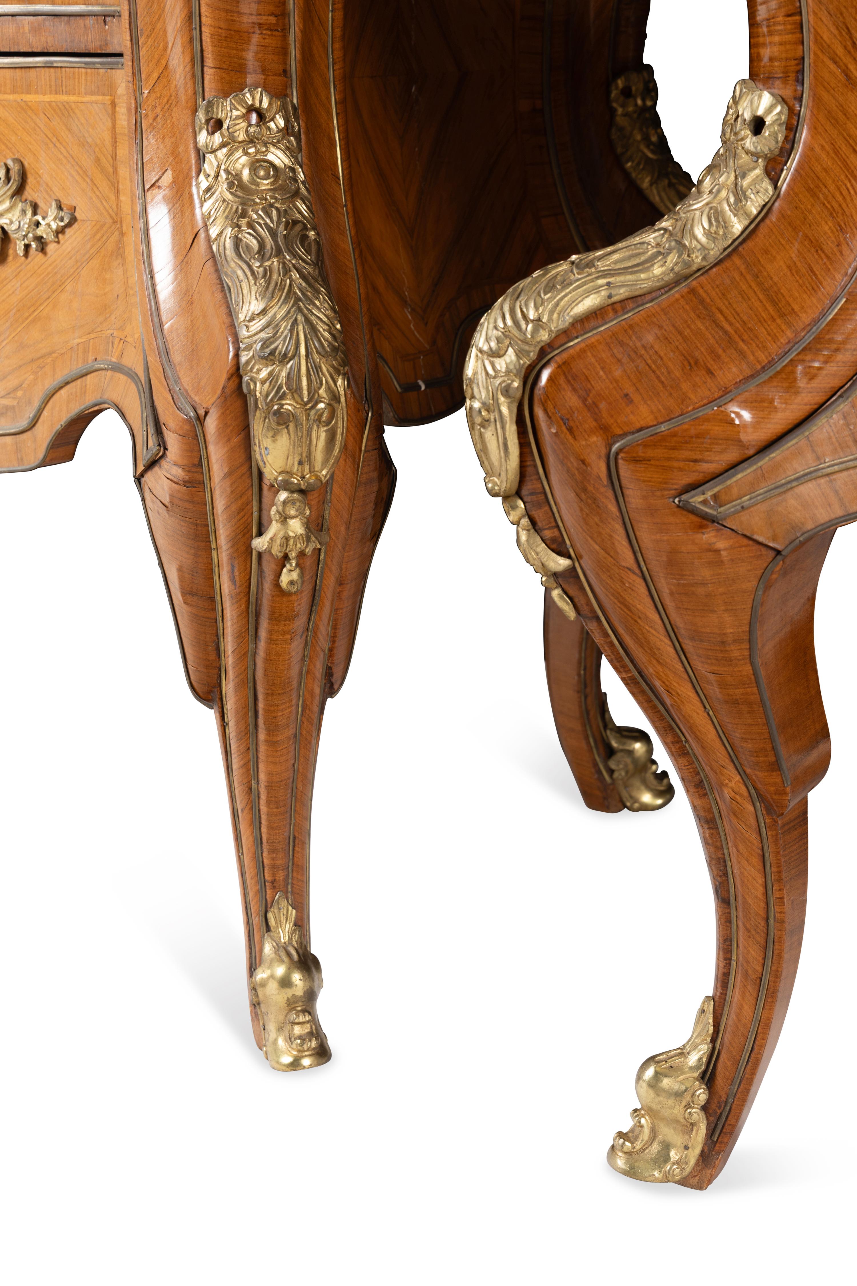 A Pair of Régence Style Gilt Bronze Mounted Tulipwood Marble-Top Commodes