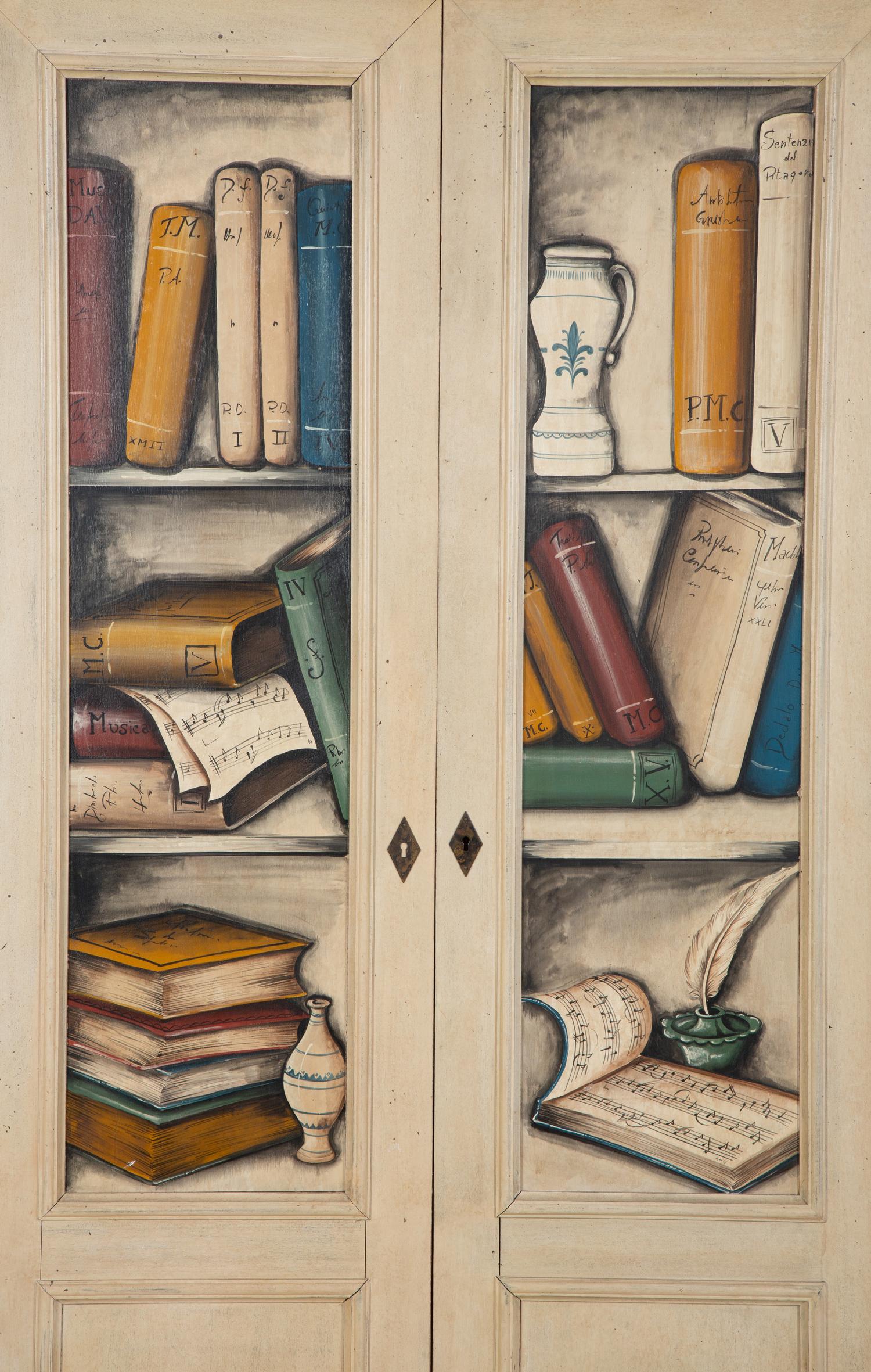 An Italian Painted Armoire with Book Decoration to the Doors