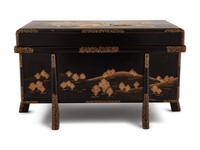 A Small Gilt Decorated Black Lacquer Trunk