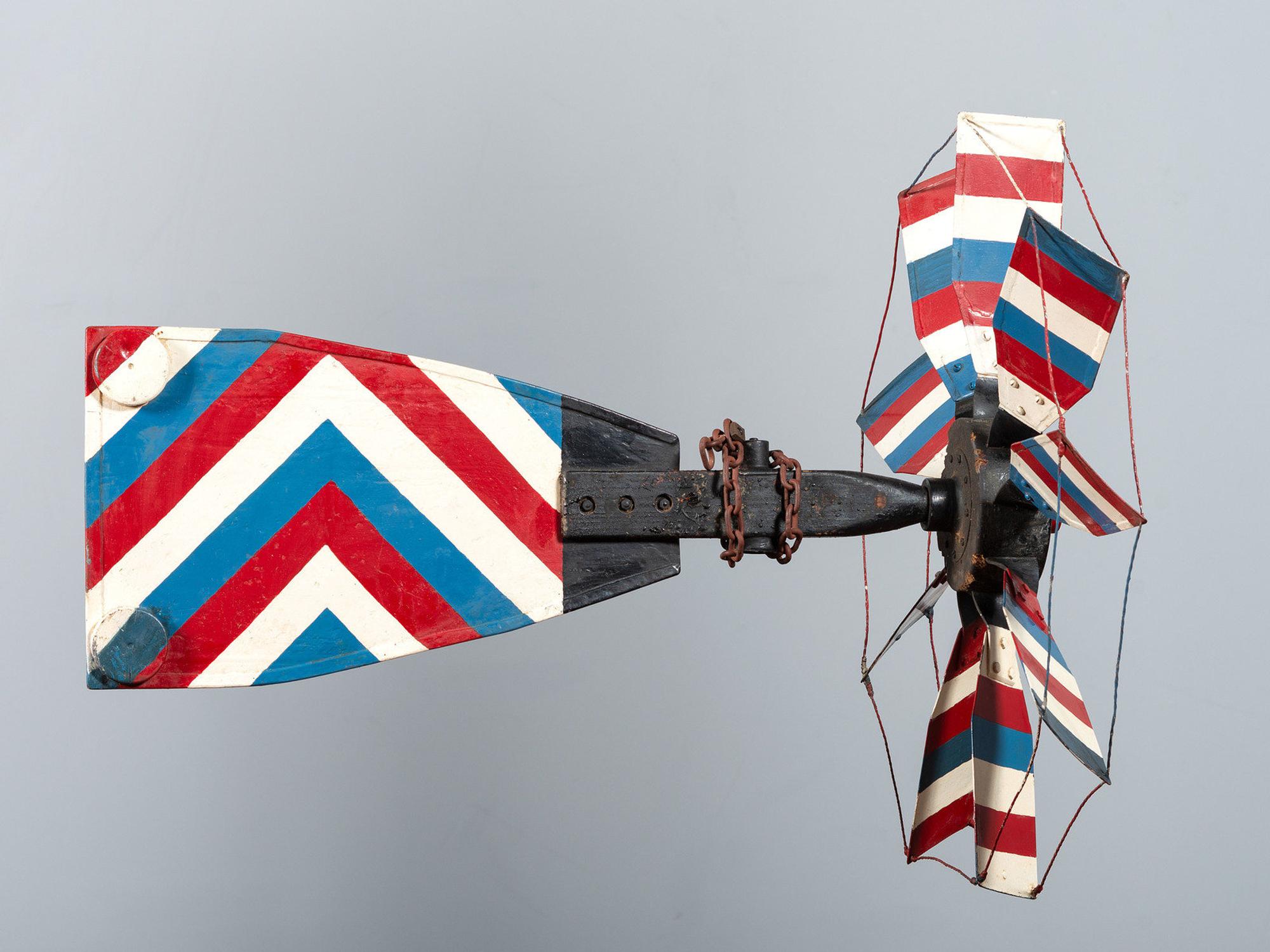 A Patriotic Red, White and Blue Painted Sheet Metal Whirligig