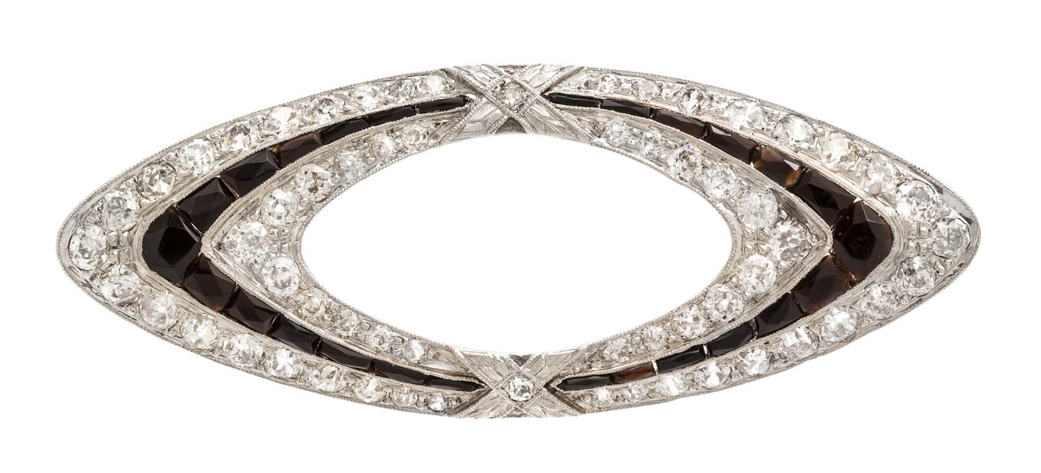 An Art Deco Platinum, White Gold, Onyx and Diamond Pendant/Brooch, 7.40 dwts.