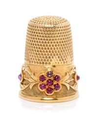 A Continental Yellow Gold and Ruby Thimble, , the knurled top and body surmounting a floral and foliate decorated band, the floral elem
