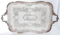 A Group of Silver-Plate Serving Trays Width of widest over handles 30 inches.