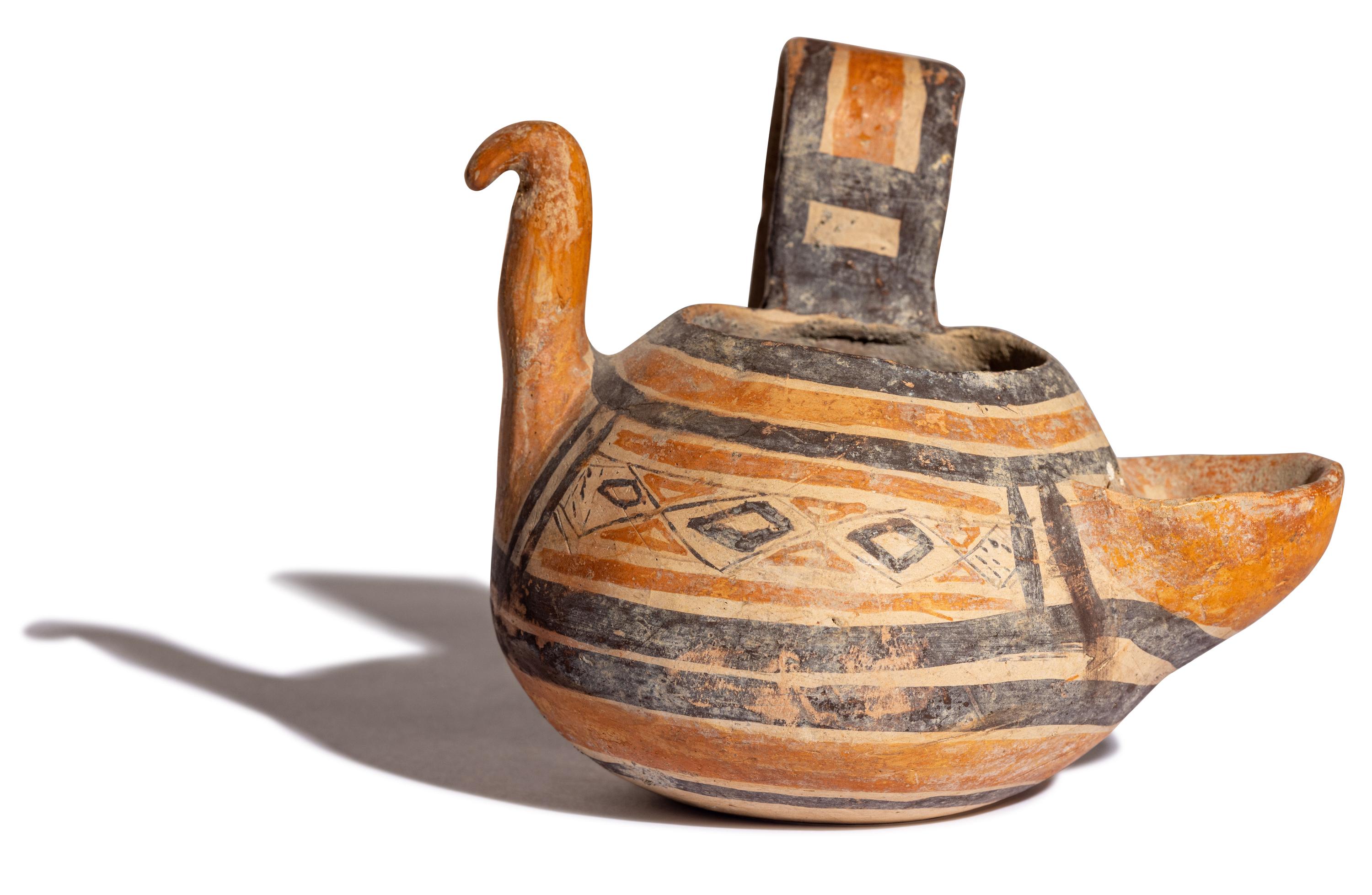 A Daunian Painted Pottery Figural Vessel in the Form of a Bird
