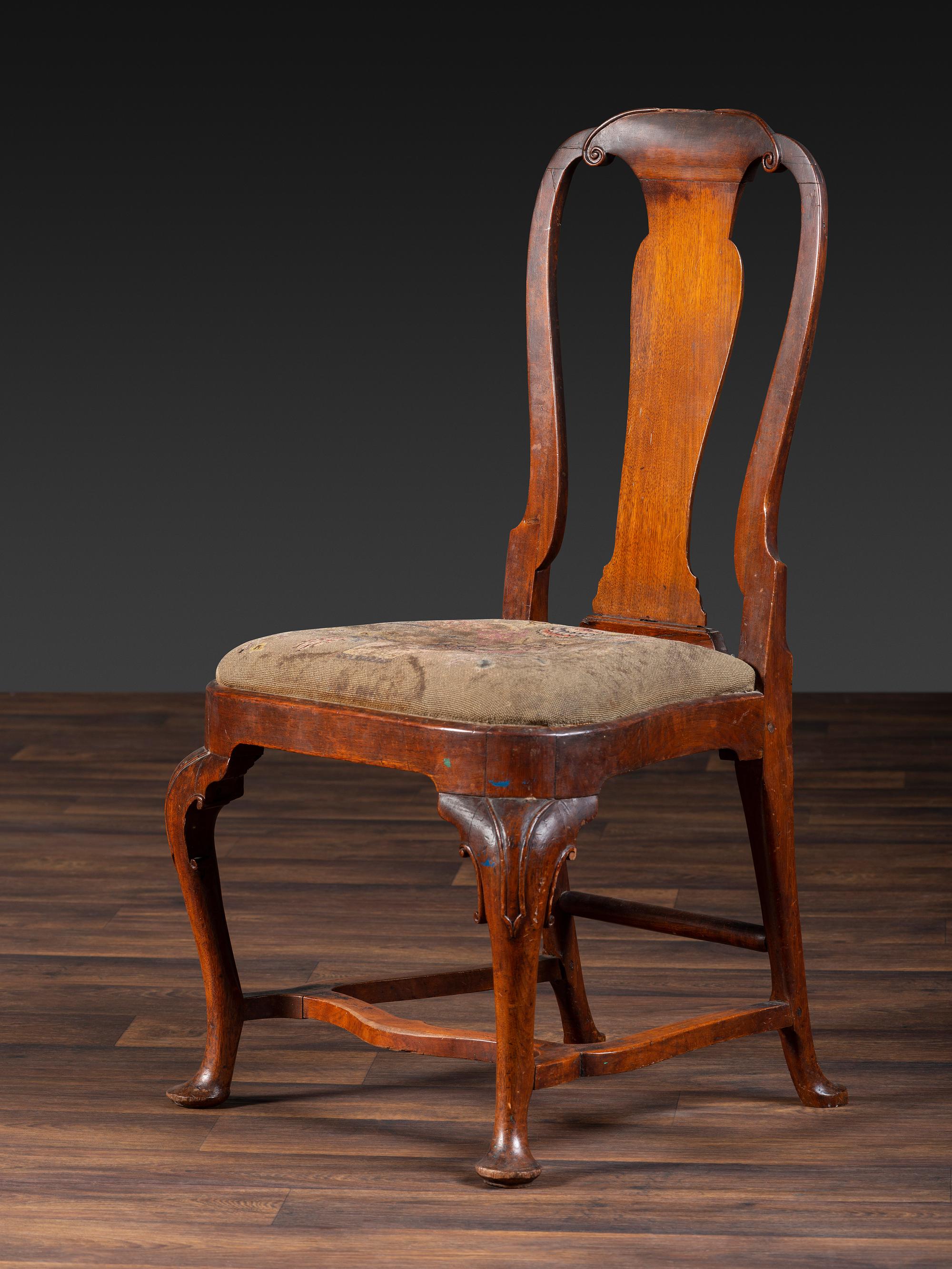 A Queen Anne Volute Carved Walnut Flat-Stretcher Pad-Foot Side Chair