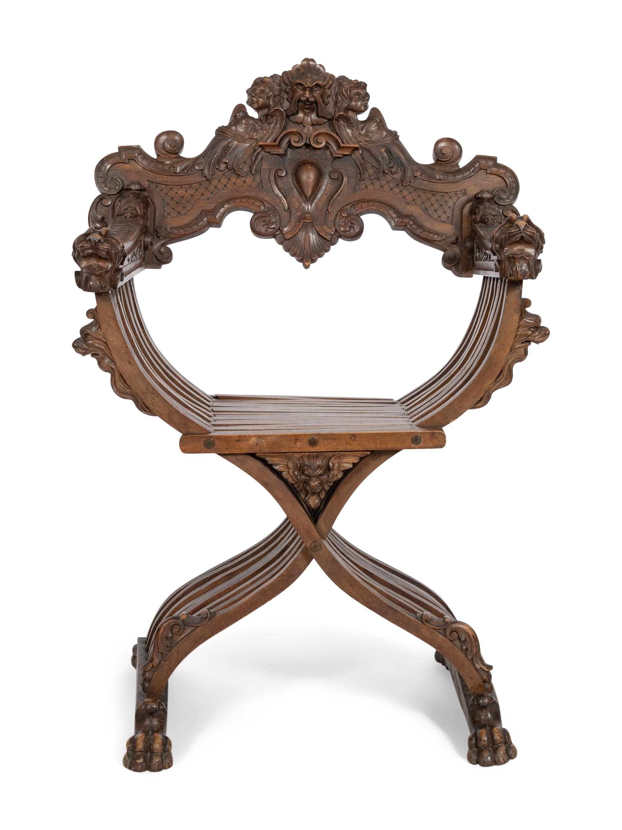 An Italian Renaissance Revival Carved Walnut Savonarola Chair