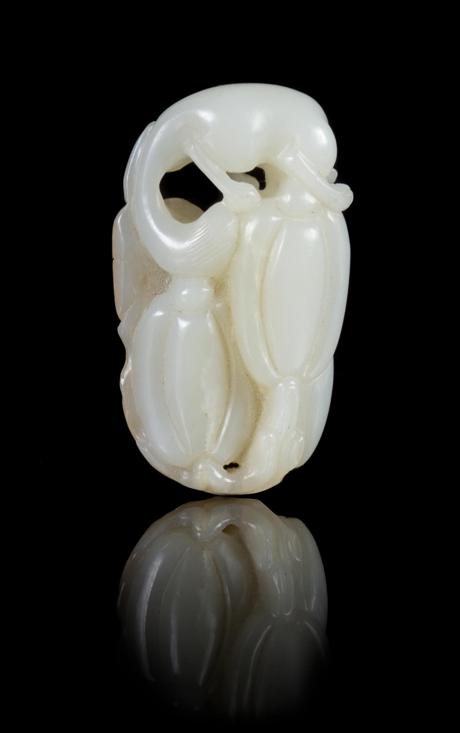 A Carved White Jade Toggle Height 2 1/4 inches.