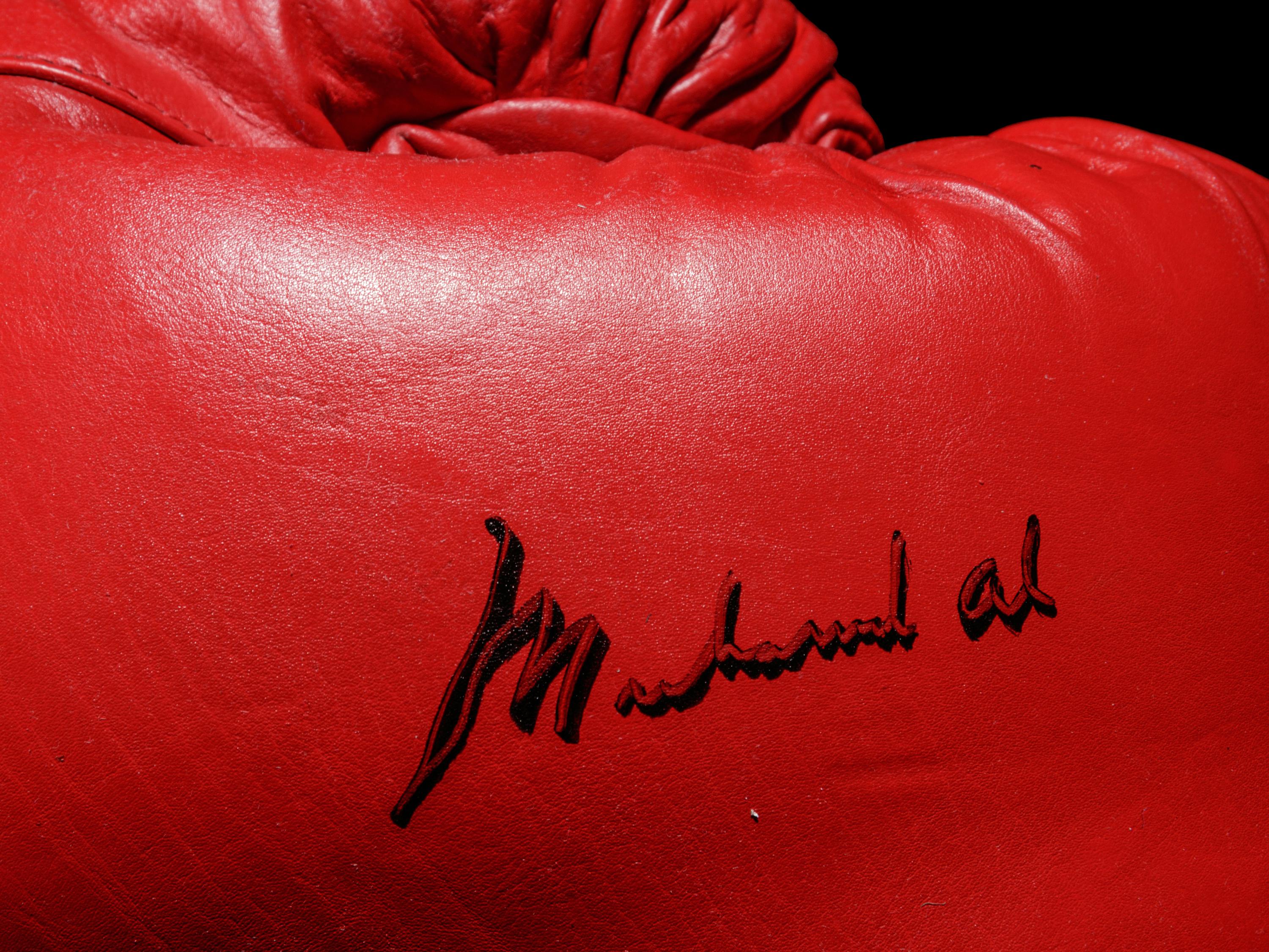 A Pair of Muhammad Ali Autographed Boxing Gloves (One Signed) Steiner,