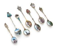 A Group of Seven Silver and Enamel Souvenir Teaspoons, Germany, Early 20th Century, comprising examples decorated with scenes and emble