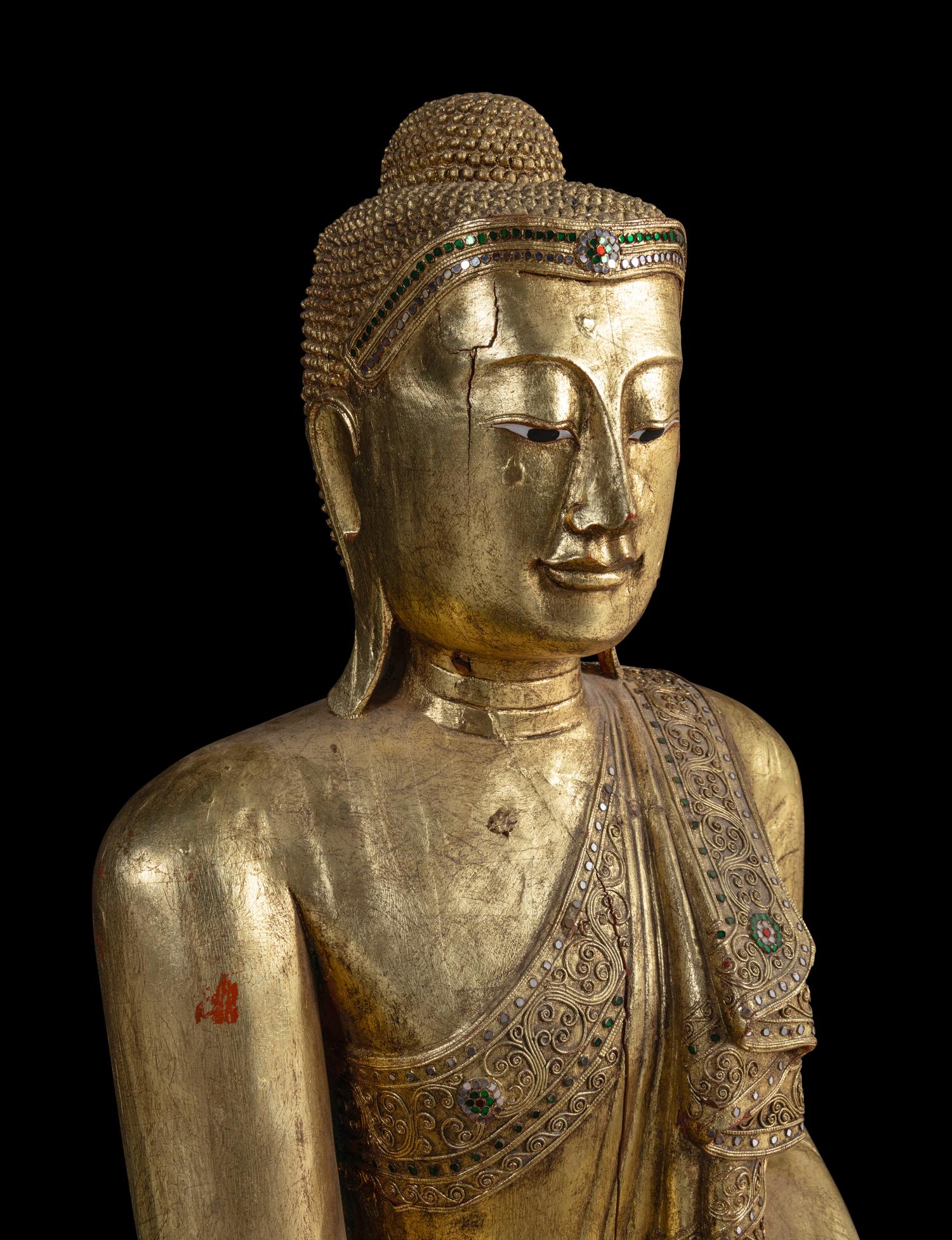 A Large Burmese Gilt Lacquered Figure of Buddha