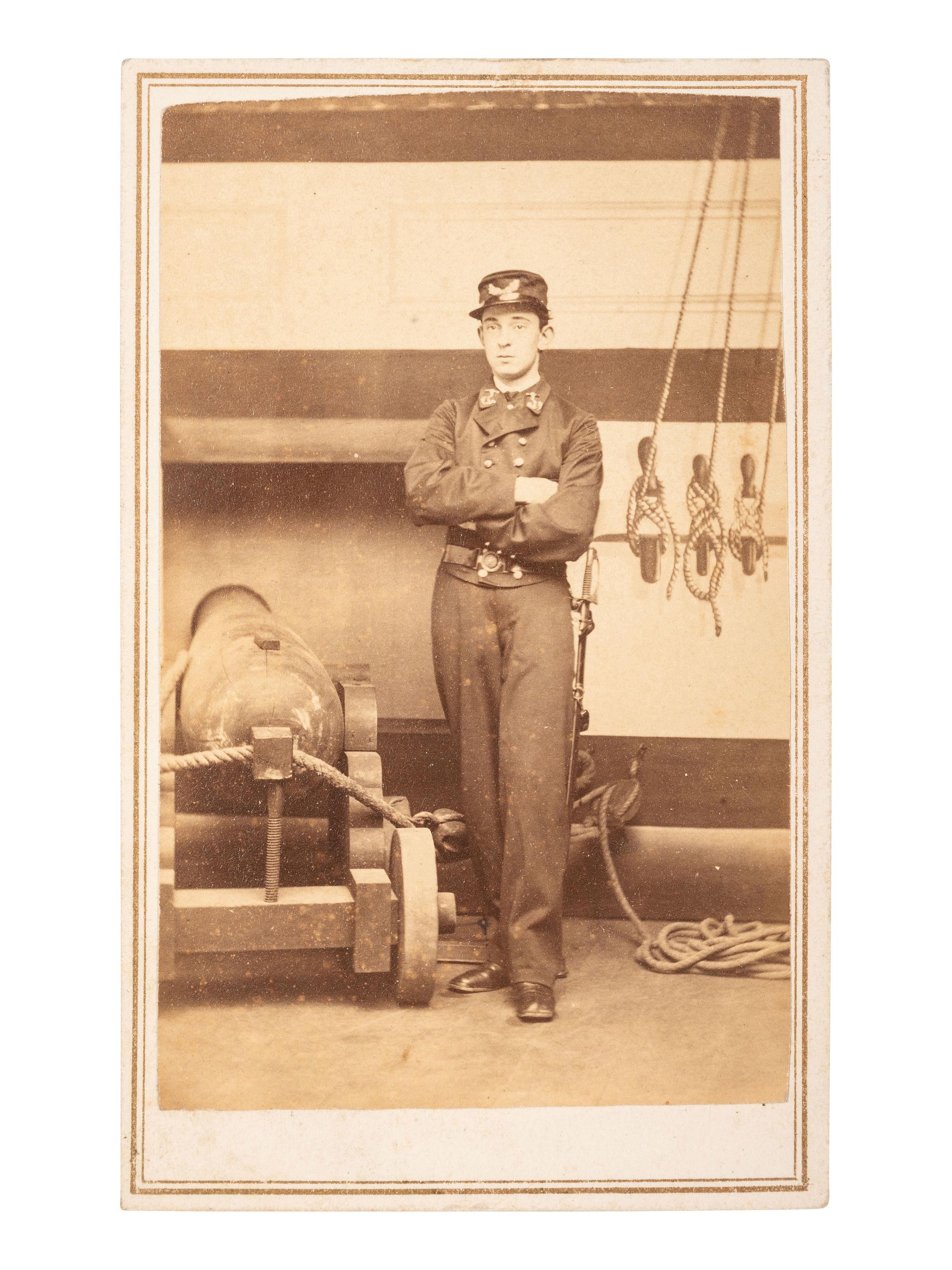 [CIVIL WAR]. CDV of a Naval ensign standing beside cannon. Newport, RI: F. Kindler, ca 1864-1865.
