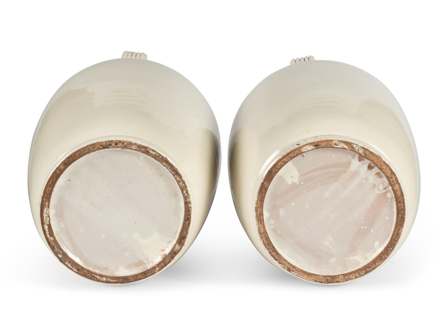 A Pair of Cream Glazed Earthenware Vases