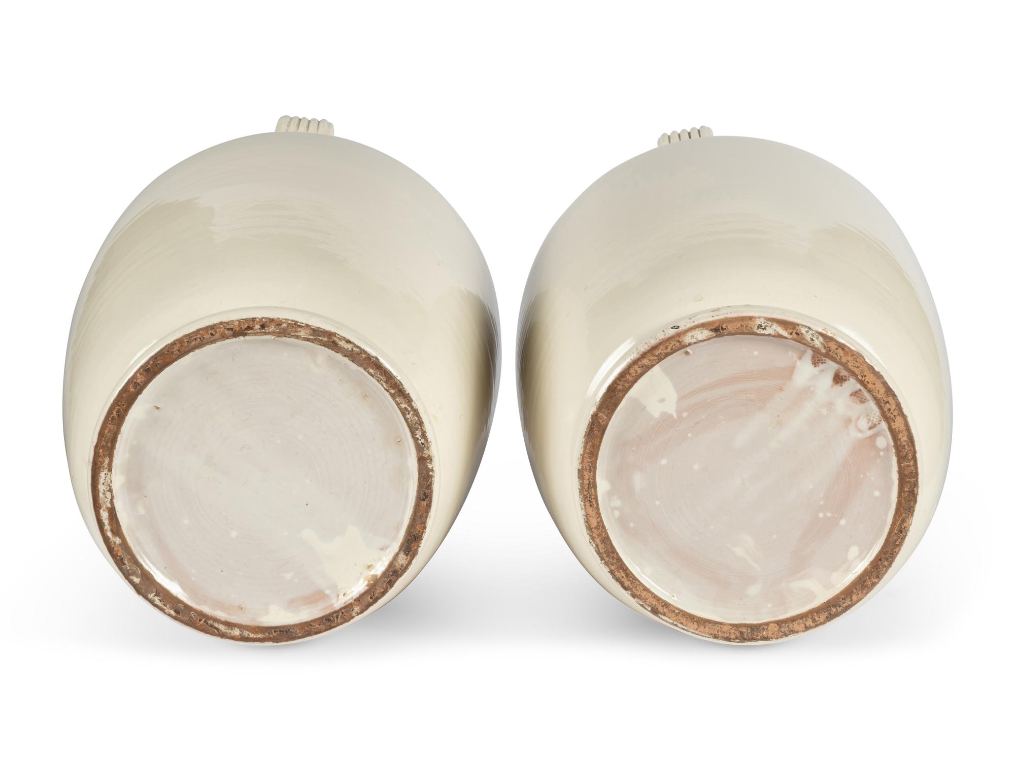 A Pair of Cream Glazed Earthenware Vases
