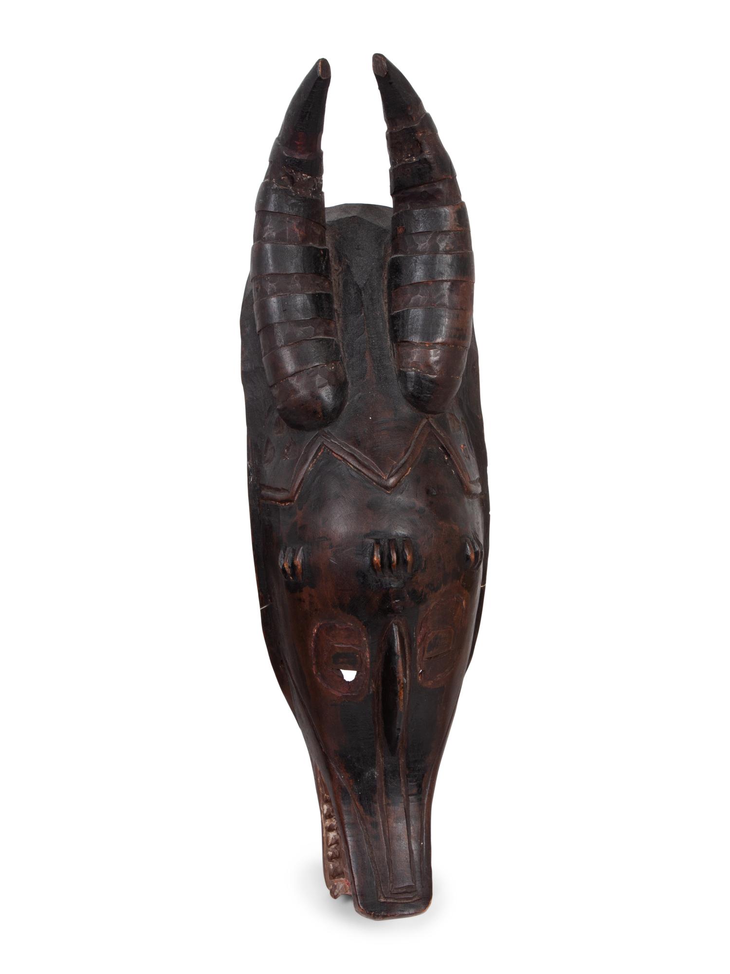 A Group of Ten Carved Ethnographic Masks